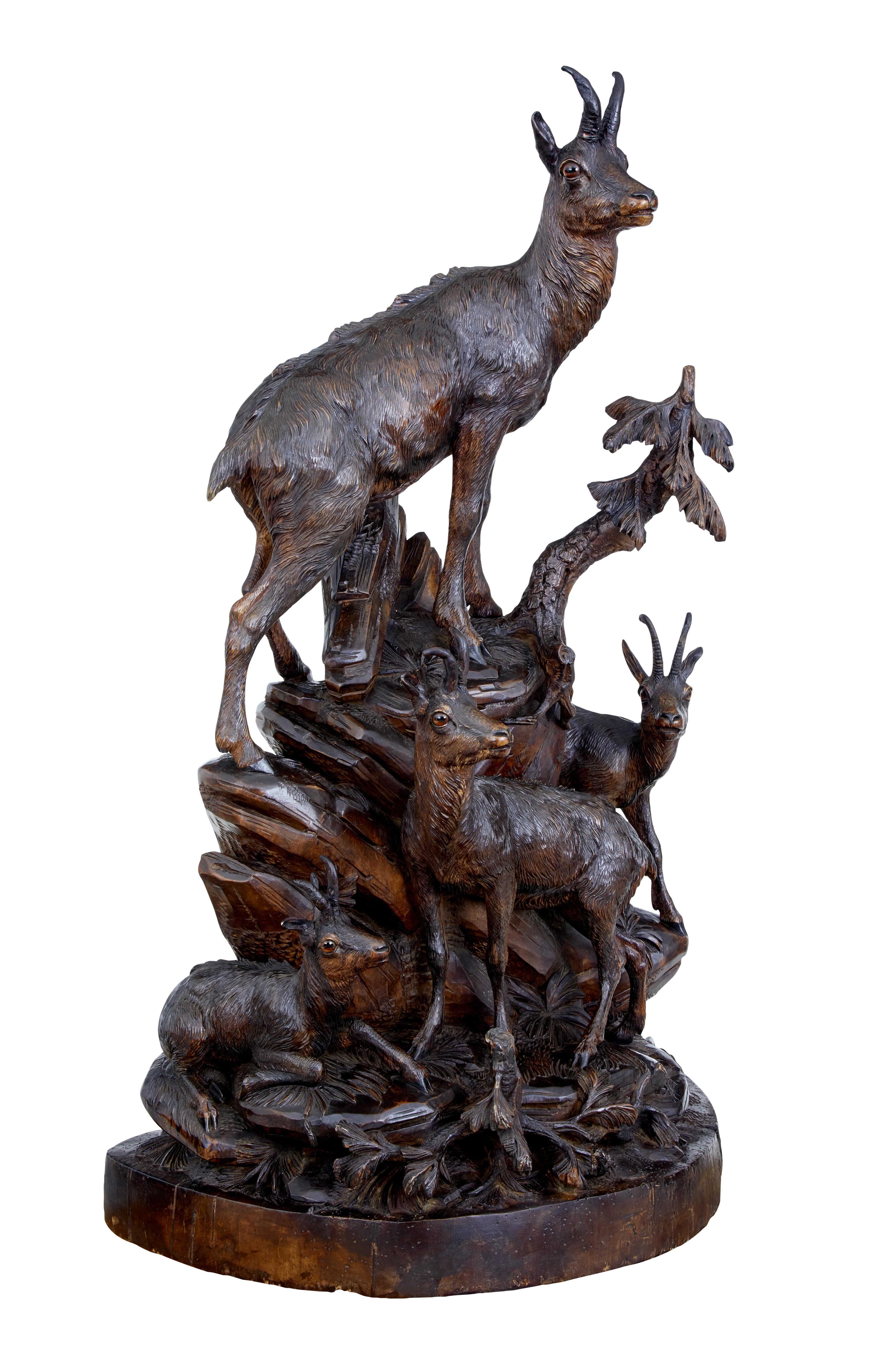 Fantastic Black Forest carving on impressive proportions, circa 1890.

Features European ibex of varying age and scale standing on carved rocks and foliage. We have owned many Black Forest sculptures but none of this scale and detail.

Original