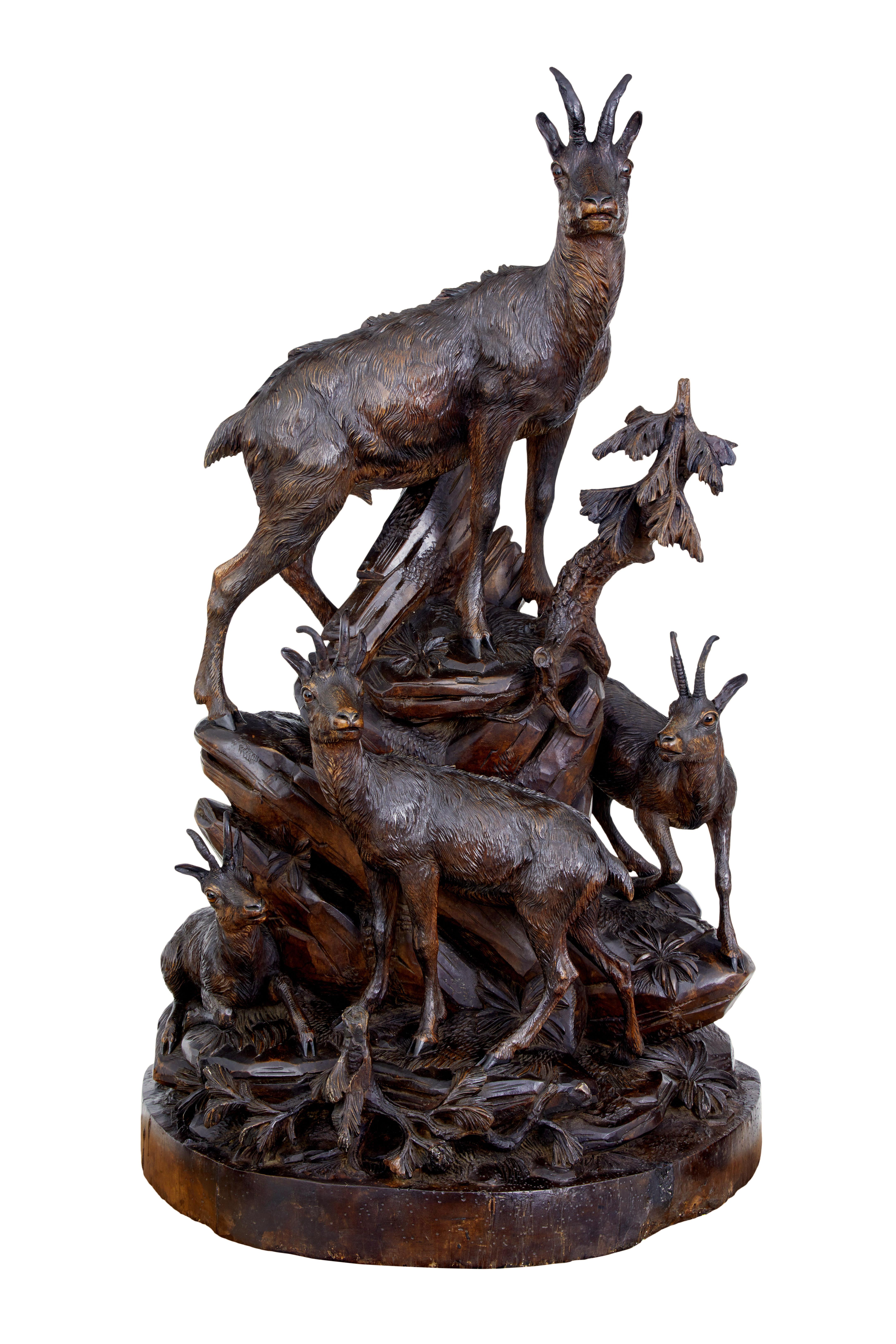 Fantastic black forest carving on impressive proportions circa 1890.

Features 4 european ibex of varying age and scale standing on carved rocks and foliage.  We have owned many black forest sculptures but none of this scale and detail.

Original