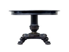 19th Century carved blackened oval center table