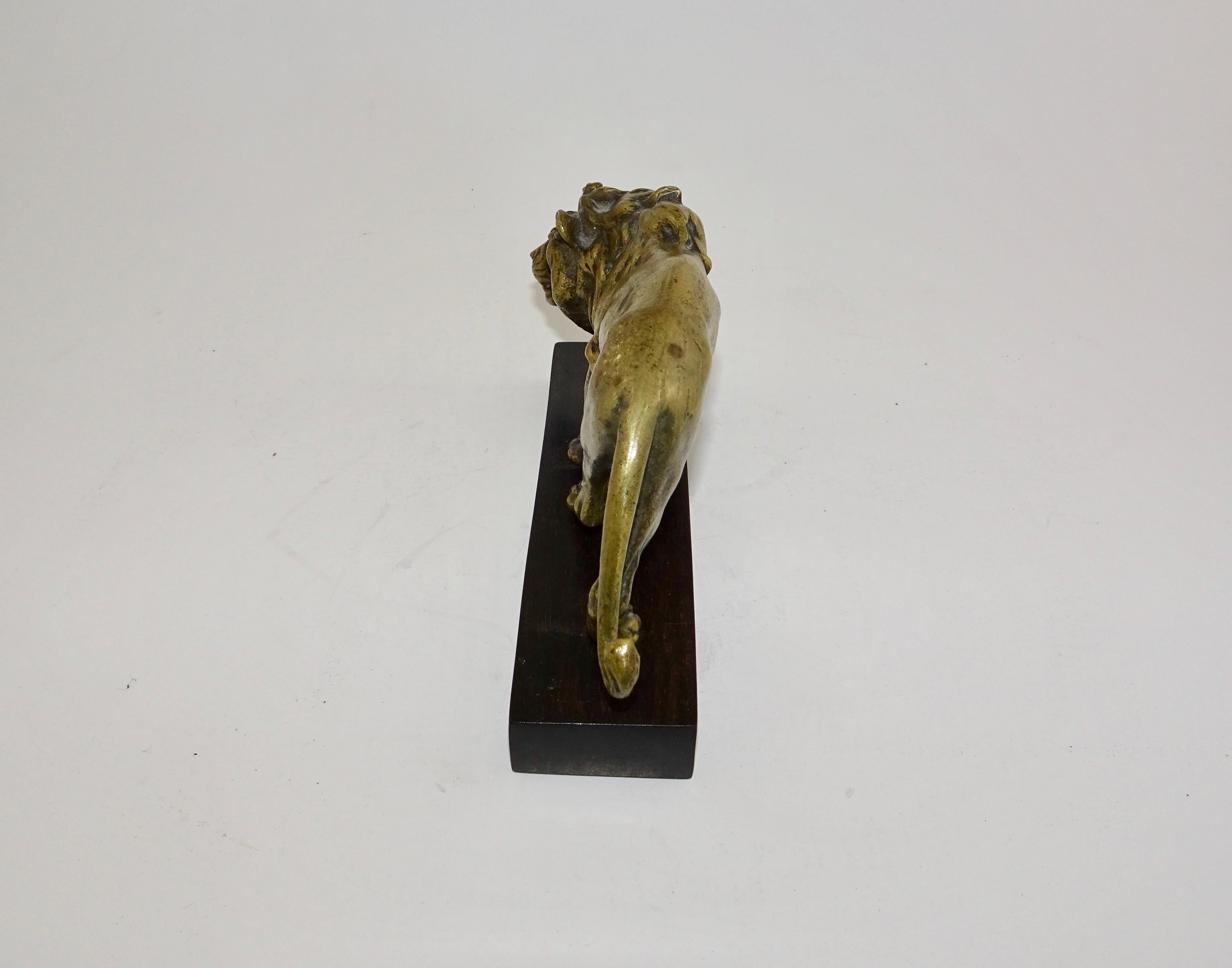 English 19th Century Carved Bronze Statue of Lion on Wooden Base For Sale