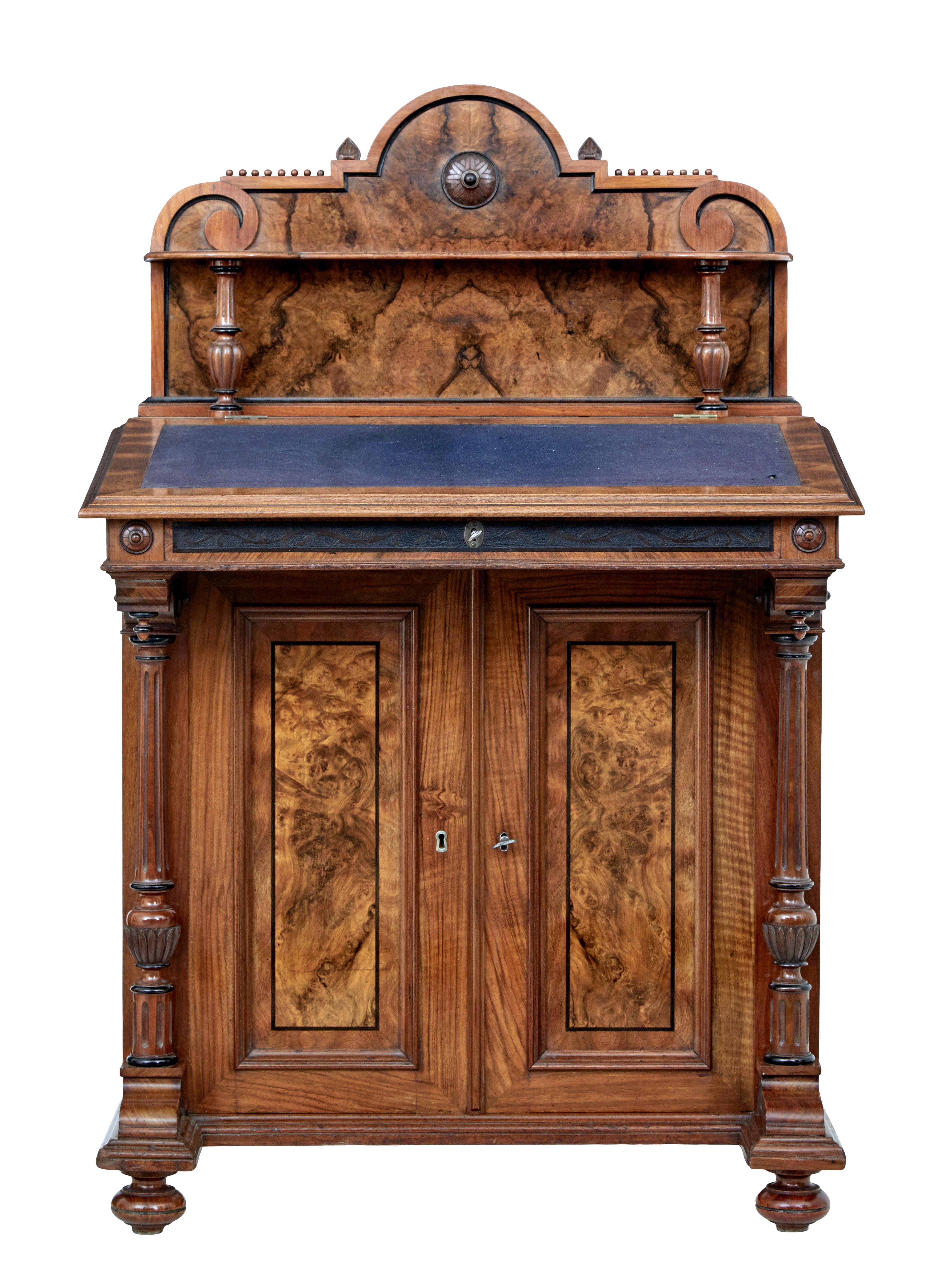 19th century burr walnut davenport writing desk, circa 1890.

Fine quality Victorian davenport made in burr walnut and decorated with ebony stringing.

Decorative back with carved scrolls and beading, forming the back drop to a shelf with turned
