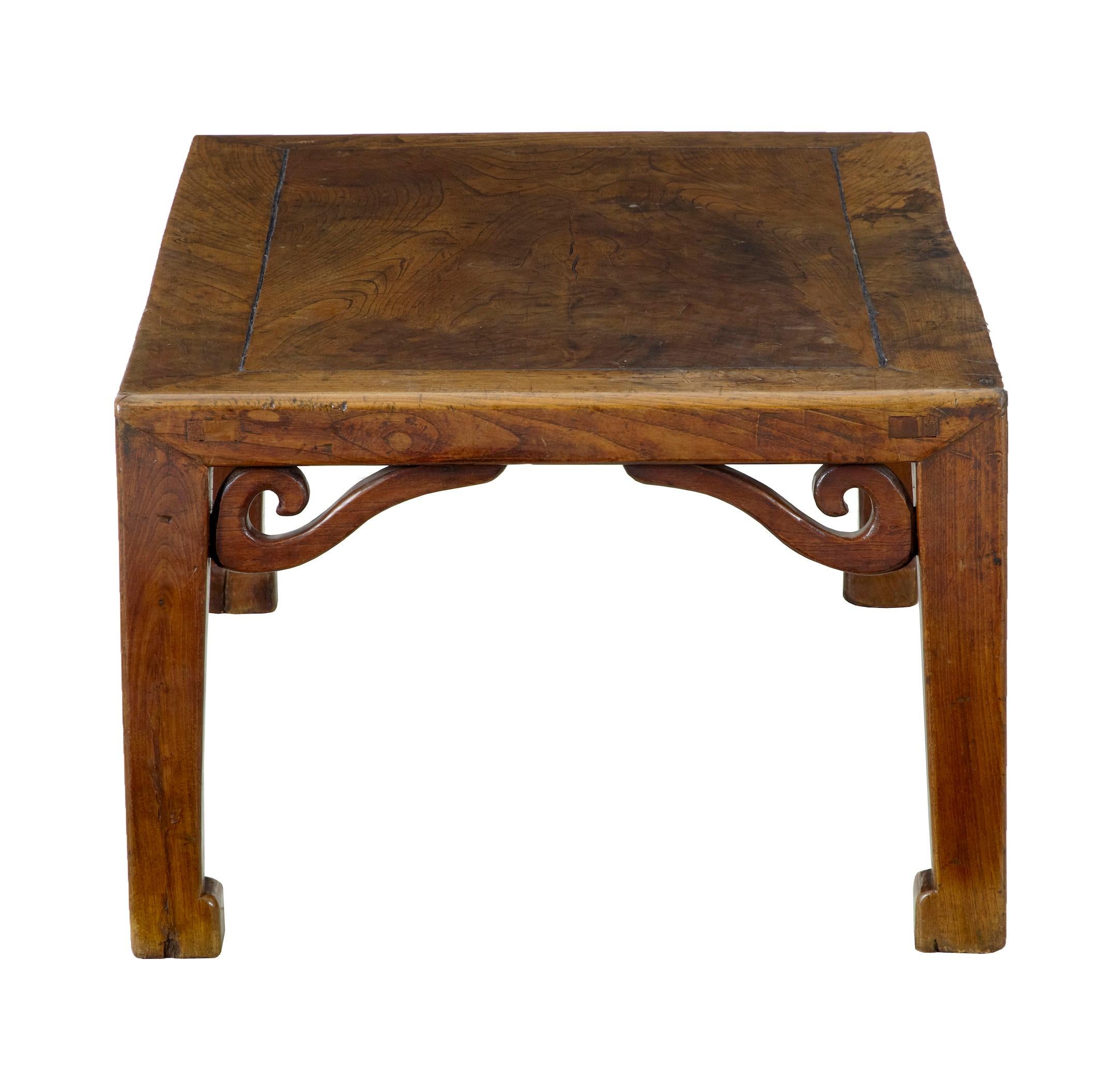 Very good quality low Chinese table, circa 1870.
Great color and patina.
Applied carved scrolls which run underneath the top.
Expected slight warping and surface marks.
   