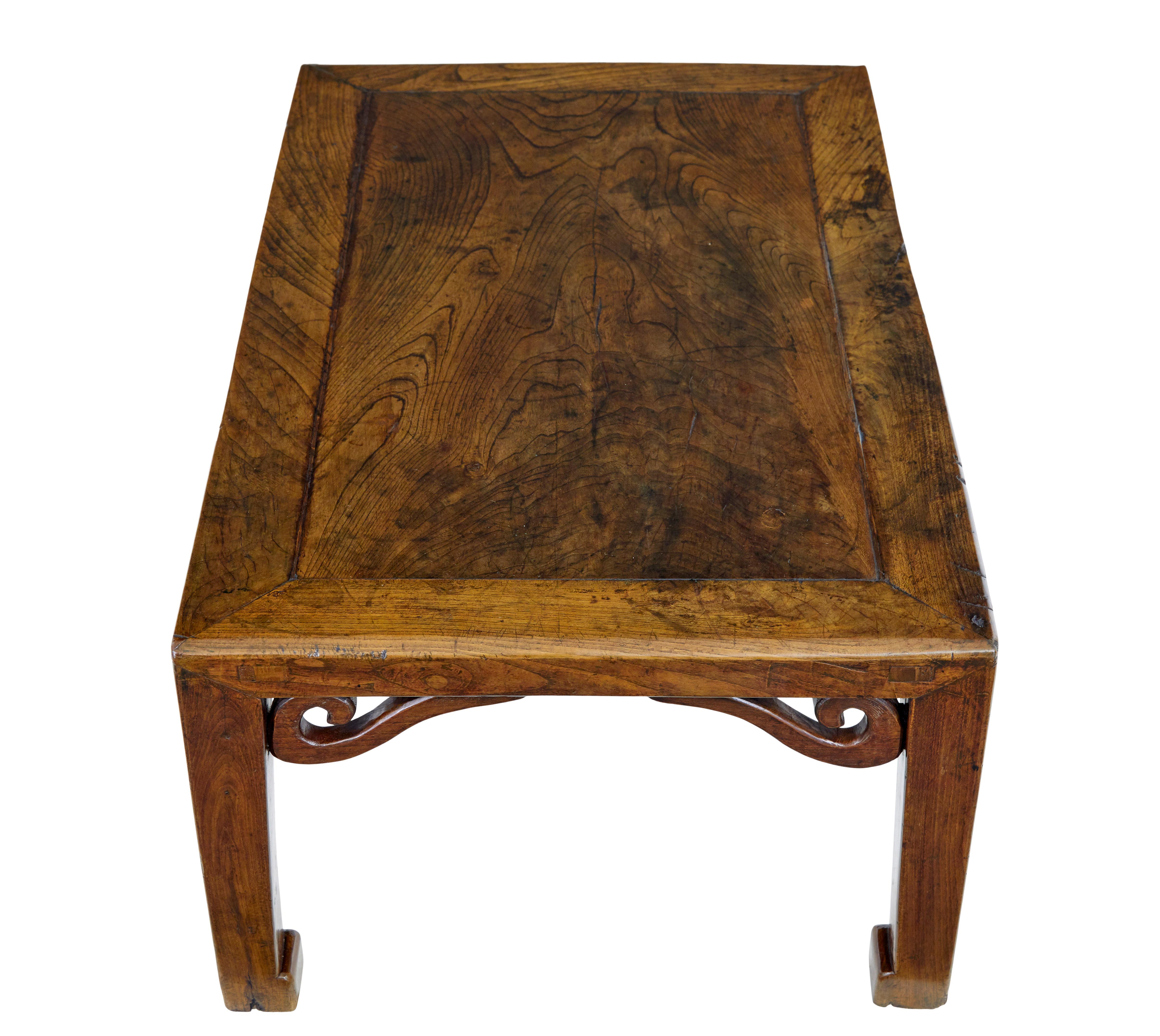 Hand-Crafted 19th century carved Chinese elm low table For Sale