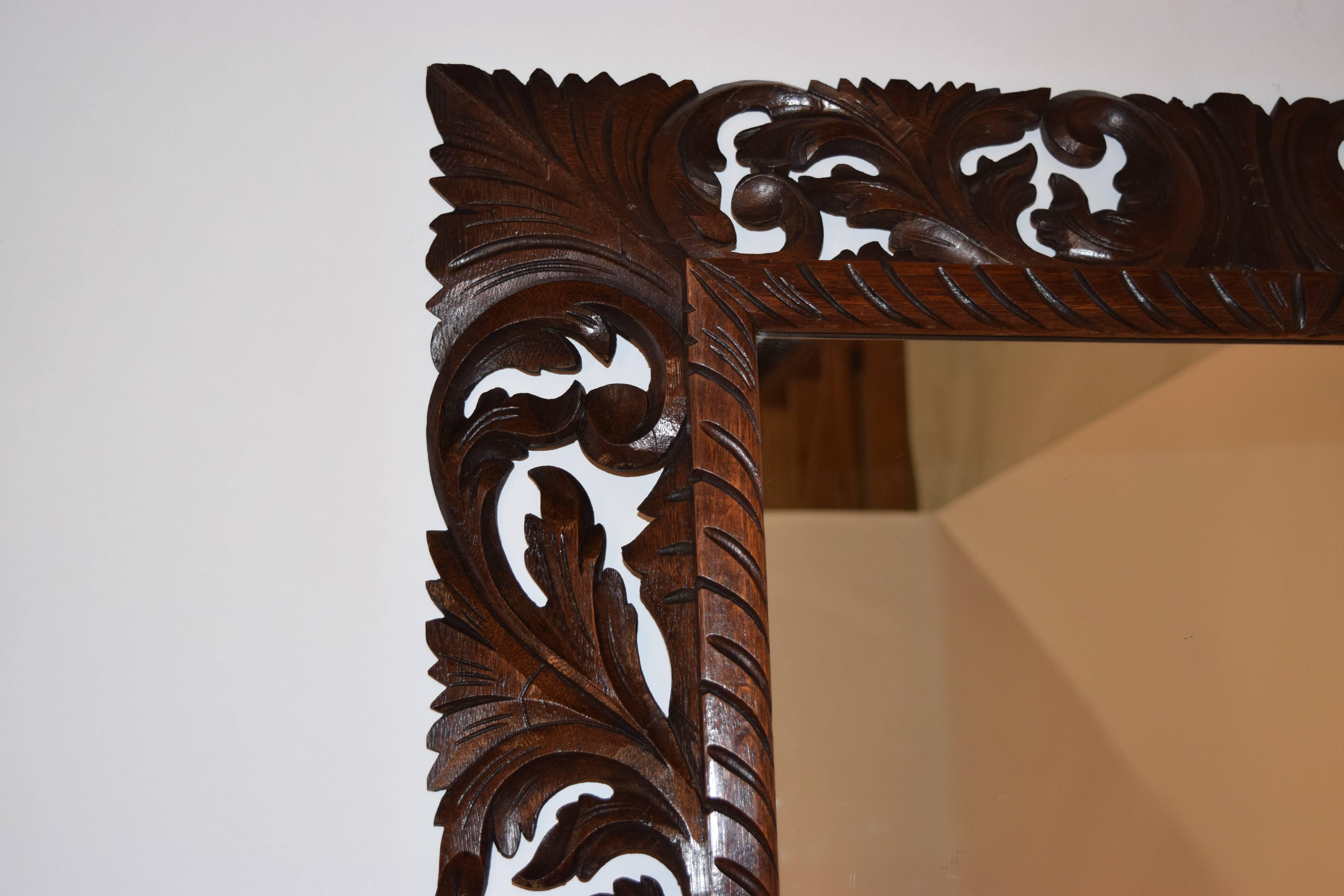 19th century English oak carved mirror with hand-carved leaves and scrolls.
 
