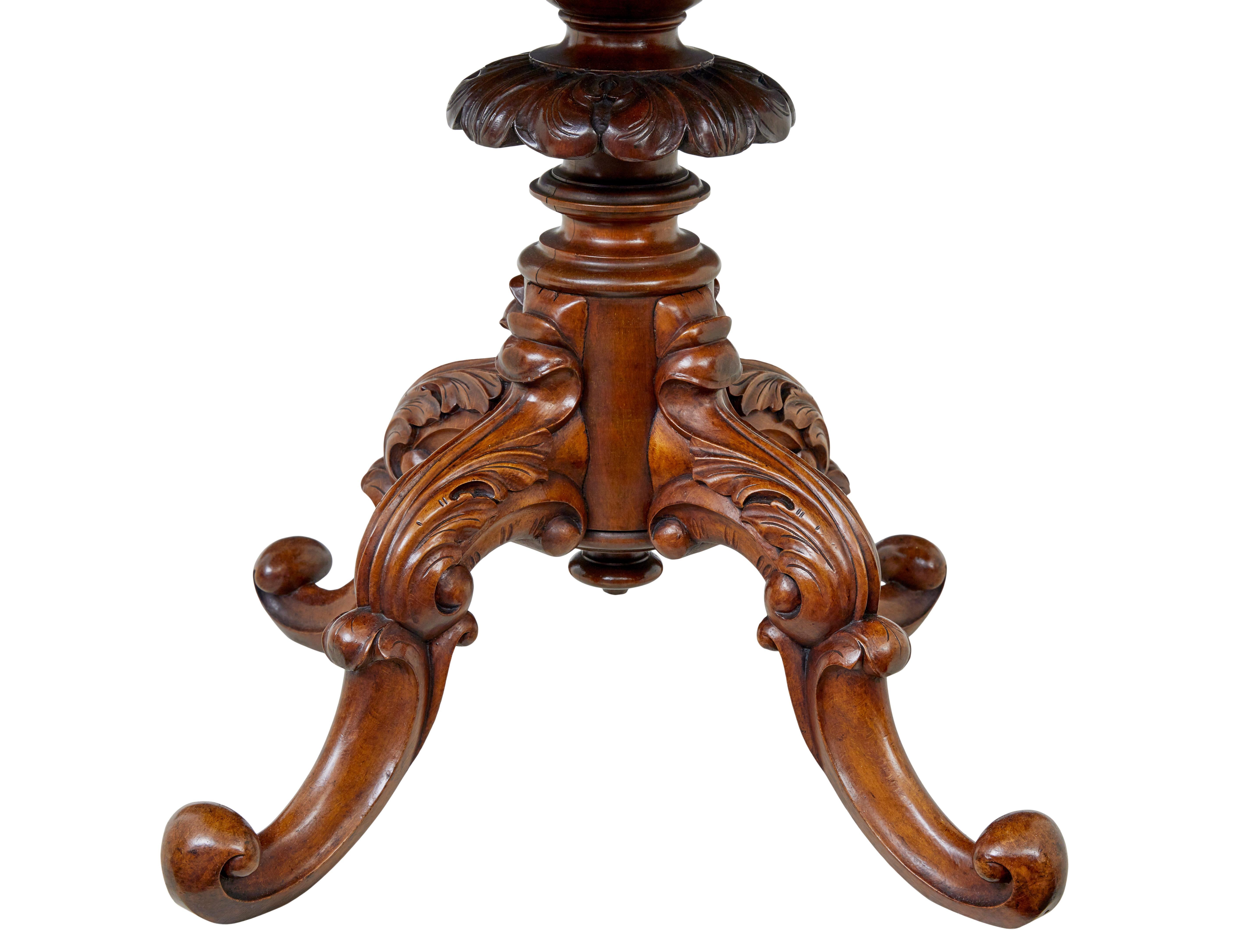 19th century carved flame mahogany center table circa 1890.

Fine quality table with multiple uses around the home.

Oval top with striking quarter matching flame timbers uses, generous frieze with a delicate applied waved moulding around the bottom