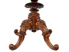 19th Century carved flame mahogany oval center table