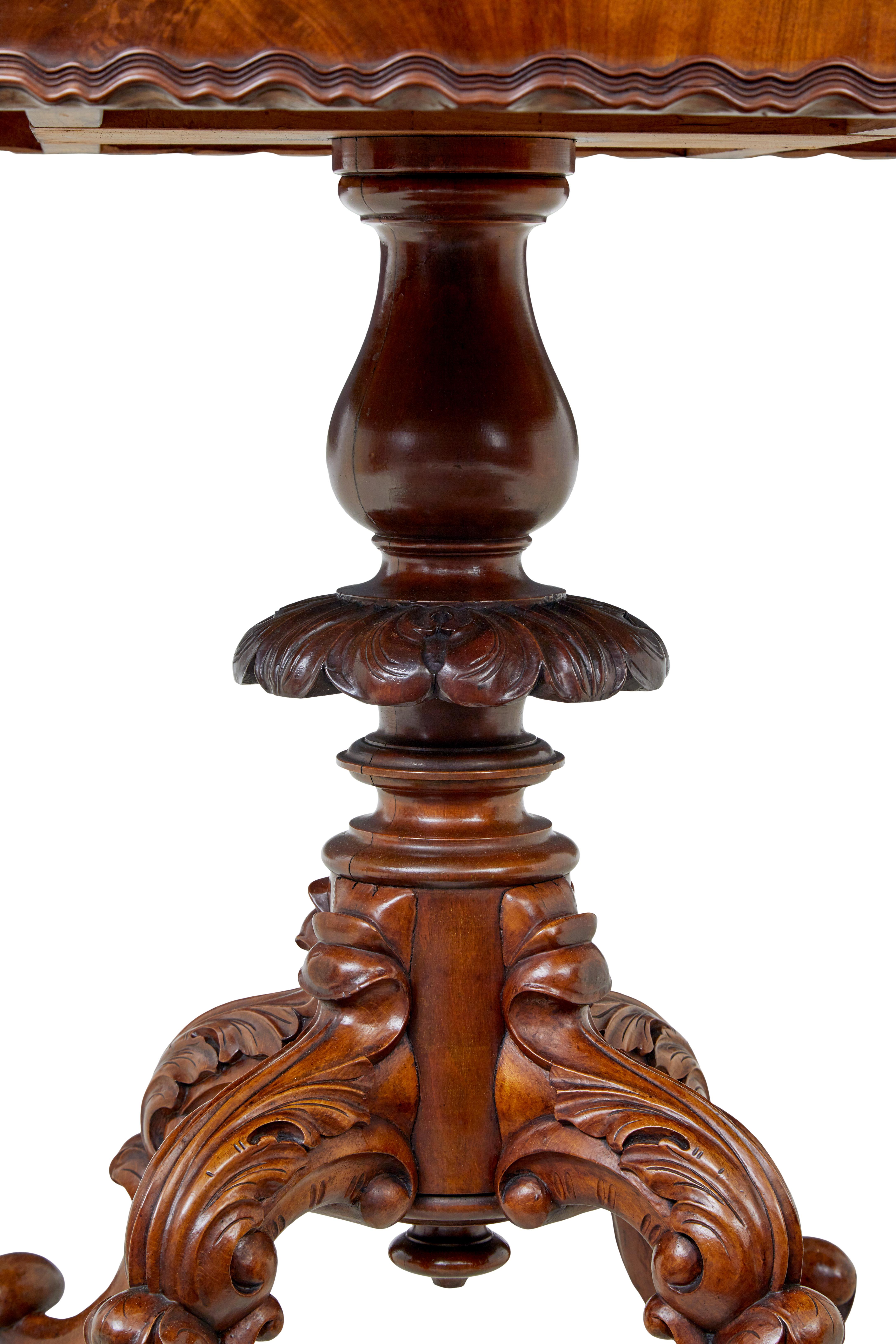 Victorian 19th Century carved flame mahogany oval center table For Sale