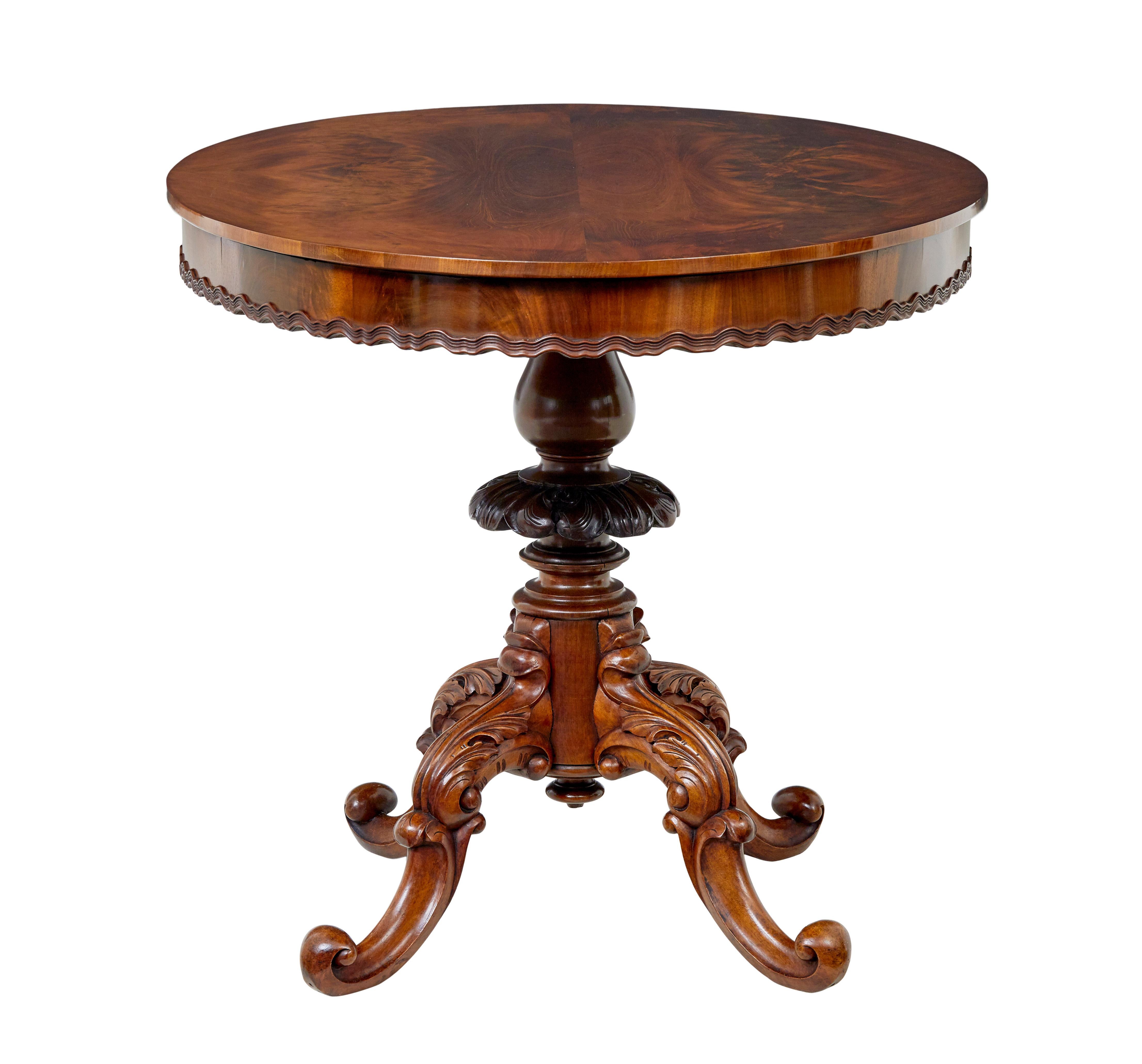 Hand-Carved 19th Century carved flame mahogany oval center table For Sale