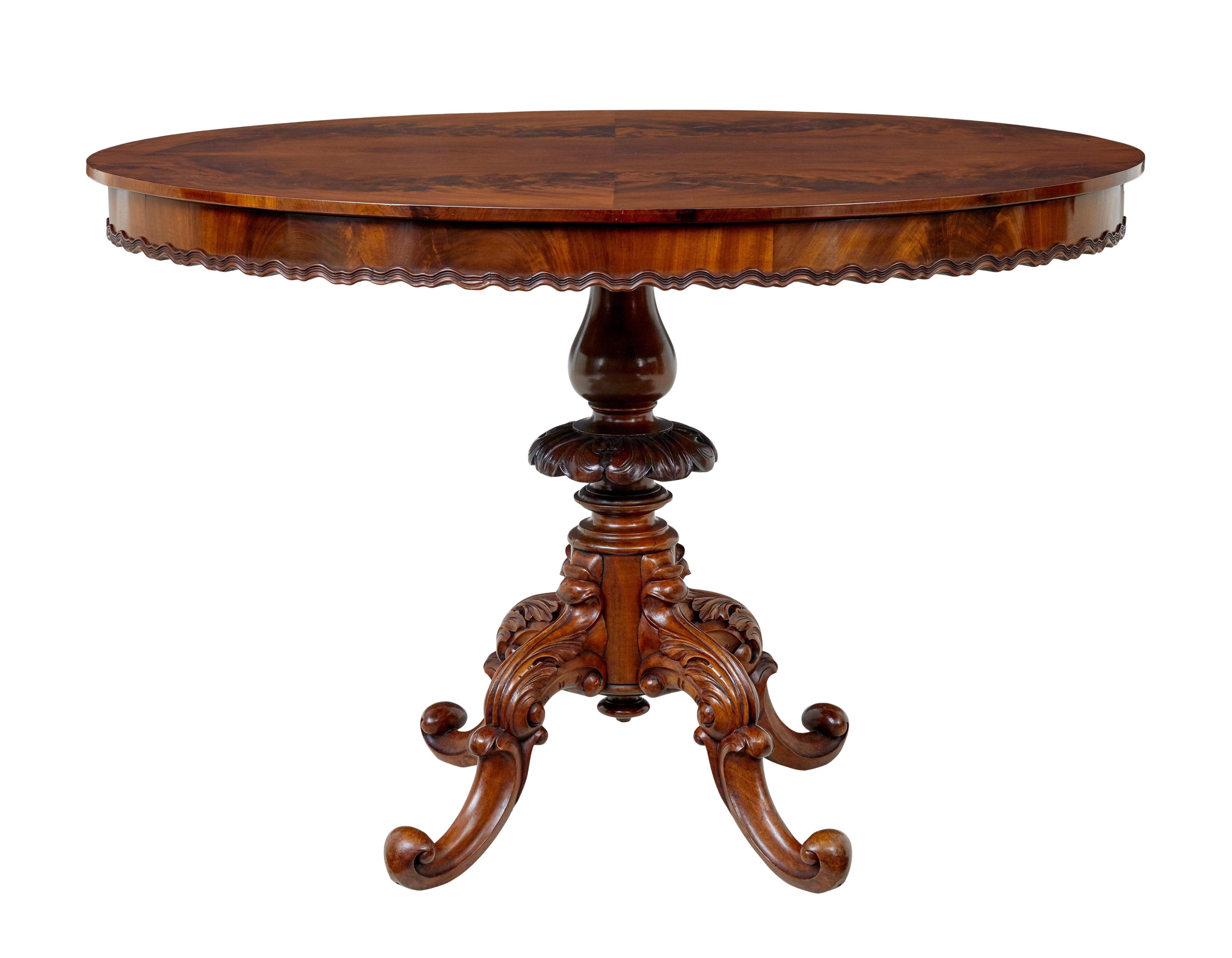 Mahogany 19th Century carved flame mahogany oval center table For Sale