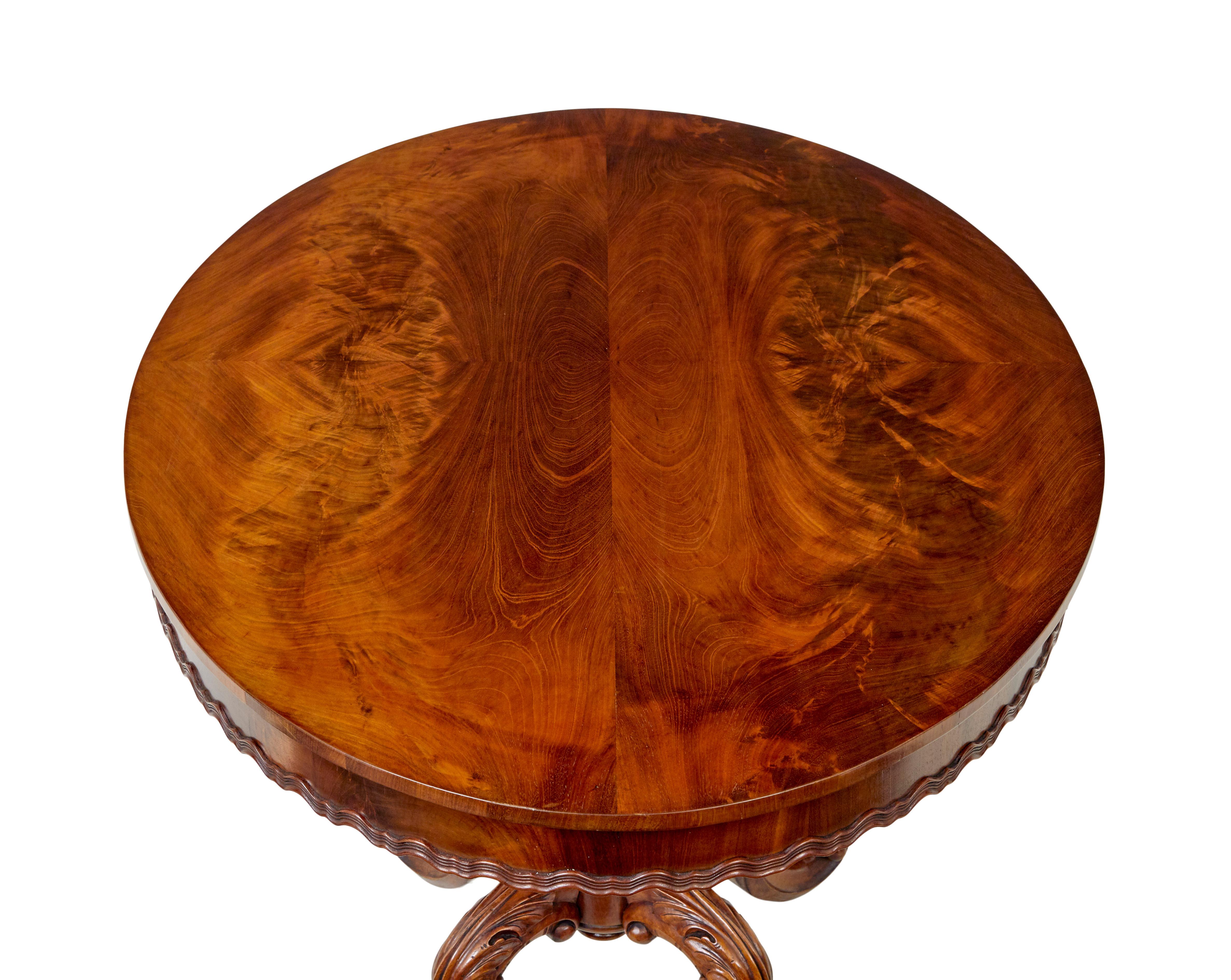 19th Century carved flame mahogany oval center table For Sale 1