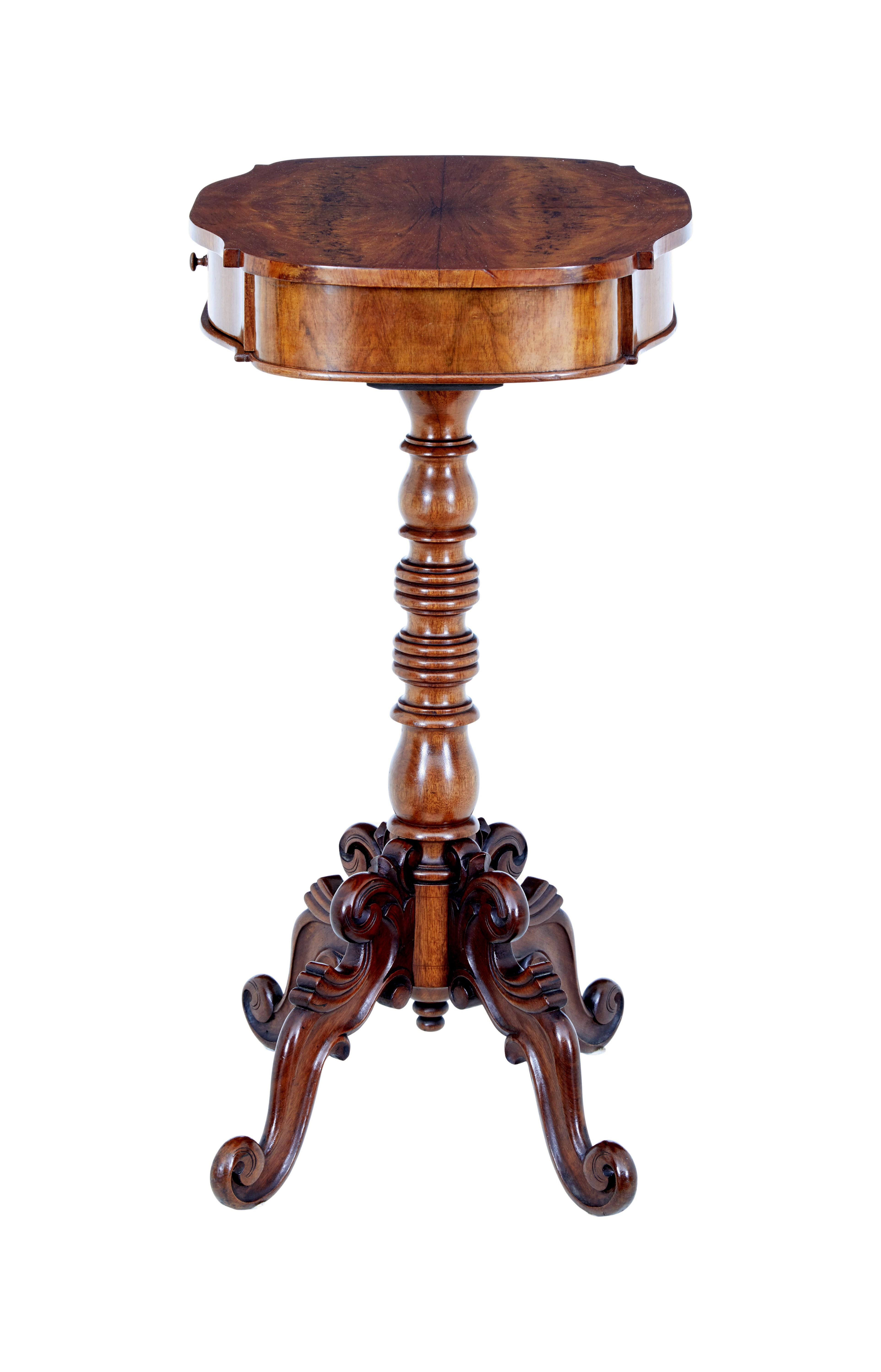 19th century Carved flame mahogany side table, circa 1890.

Fine quality shaped top surface with matched flame mahogany veneers.  Single drawer for storage.  Turned column support which links to the 4 carved scrolling legs.

Ideal for a lamp or