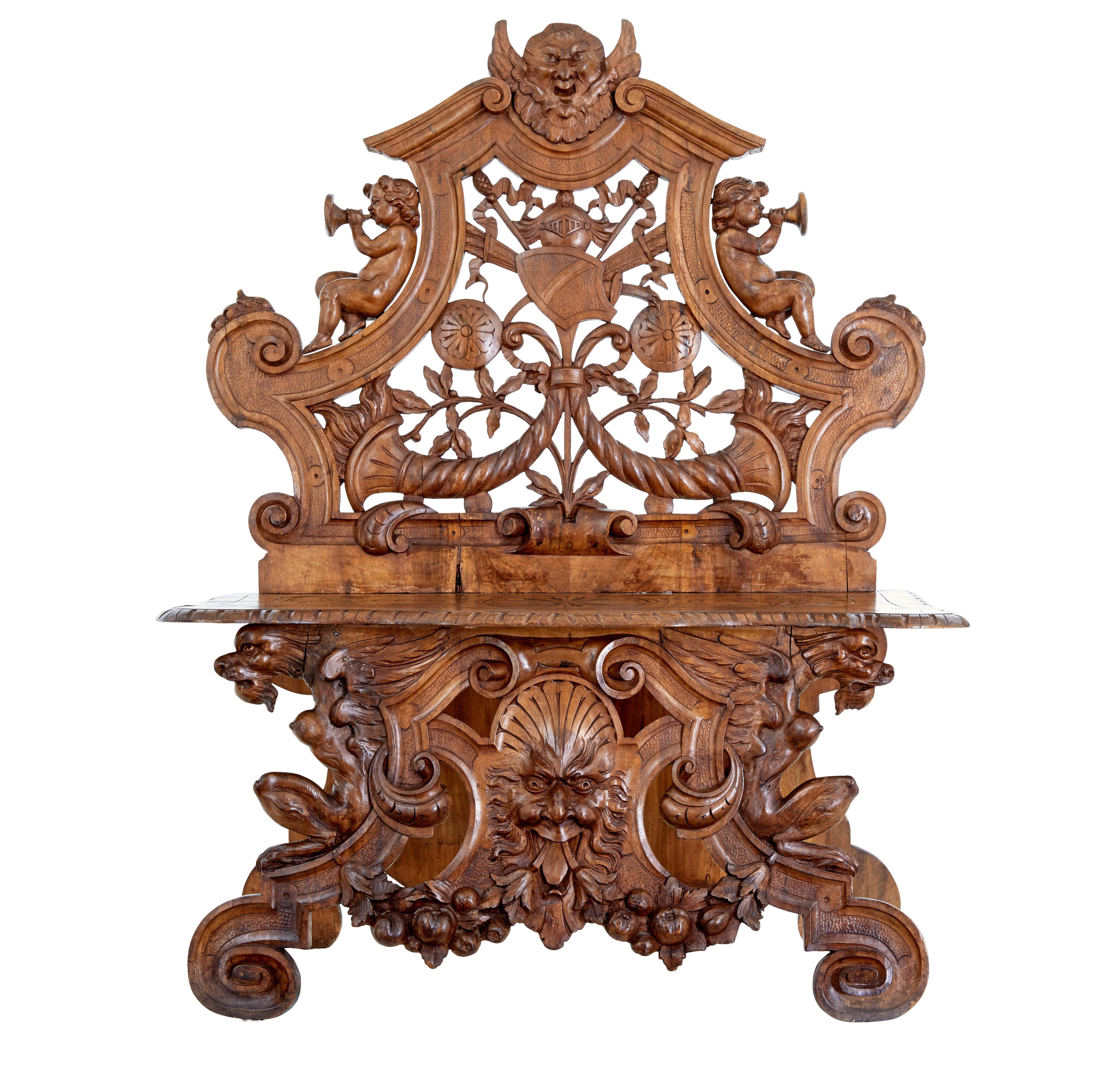 19th century heavily carved flemish walnut decorative chair circa 1890.

Carved back rest with mythical head, cherubs, armorial design and cornucopia.  Carved pattern to the shaped seat.  Front  legs with carved griffins, scrolls and a further