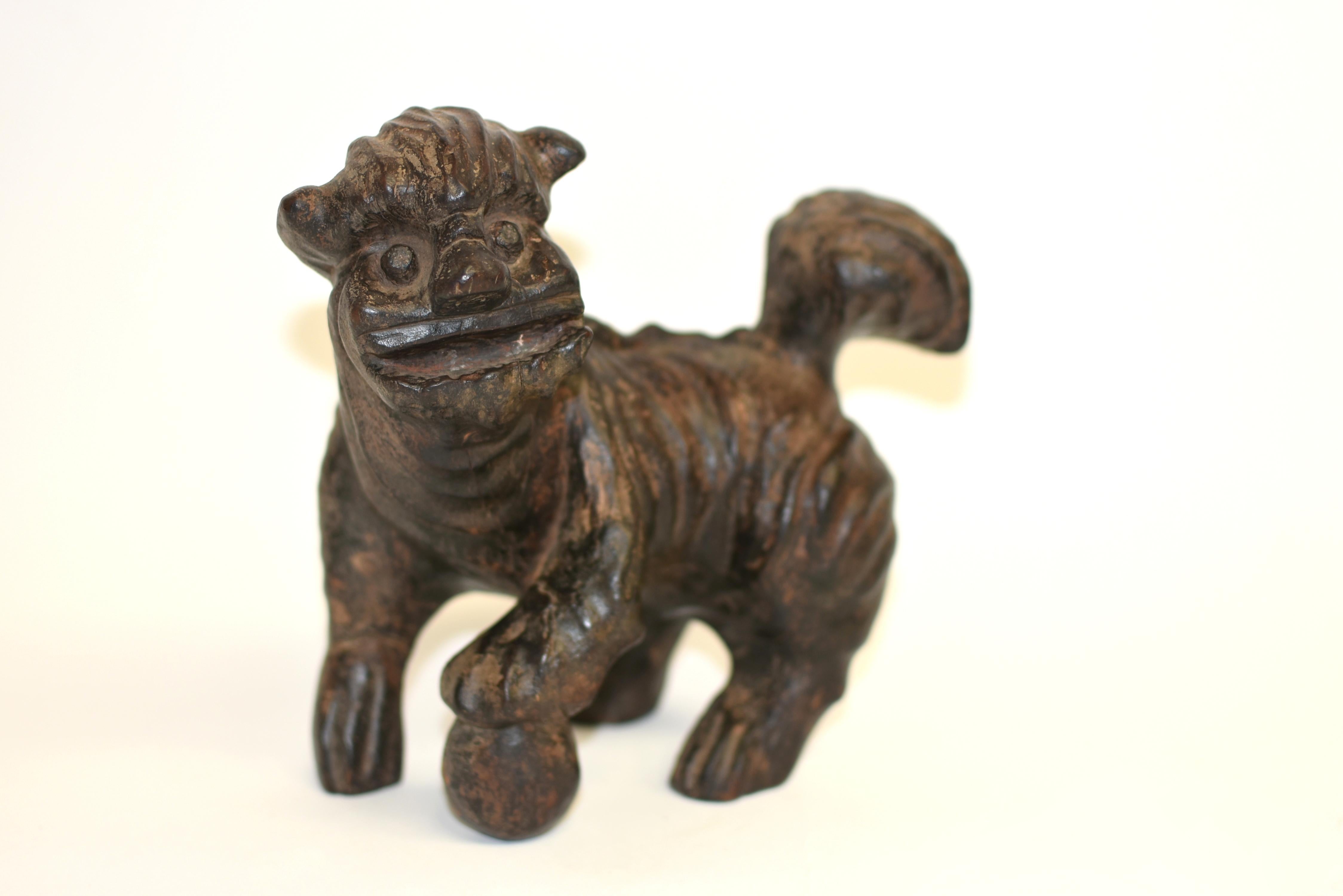 A wonderful piece of folk art from ancient ShanXi, China. Carved from the whole root of a jujube tree, this 19th-century Chinese foo dog embodies both rustic charm and cultural symbolism. With a wide mouth, expressive eyes and robust tail, the