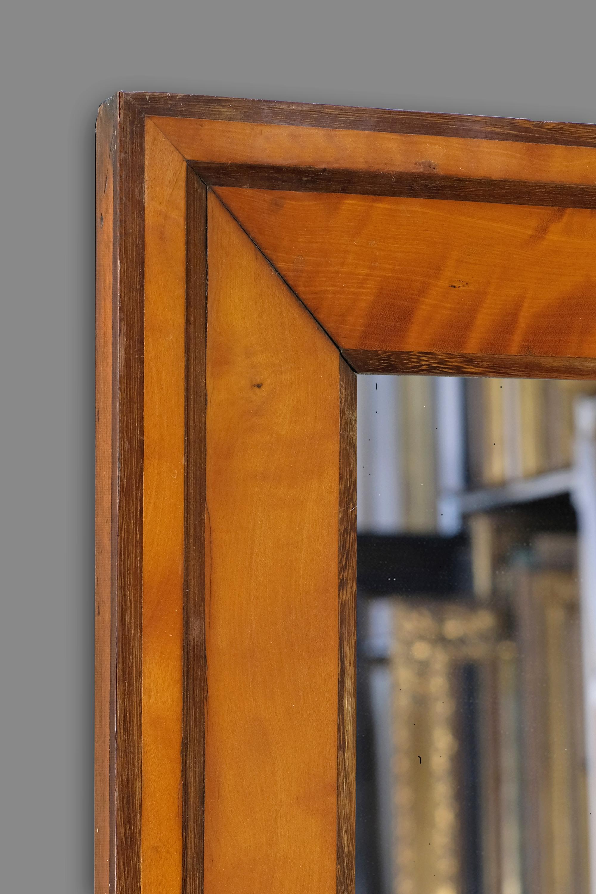 A 19th century French Biedermeier frame with an architrave profile. The frame is veneered in Cherrywood with darker stained borders, and retains its original patina. Further information on this style of frame available on request. 

The frame can