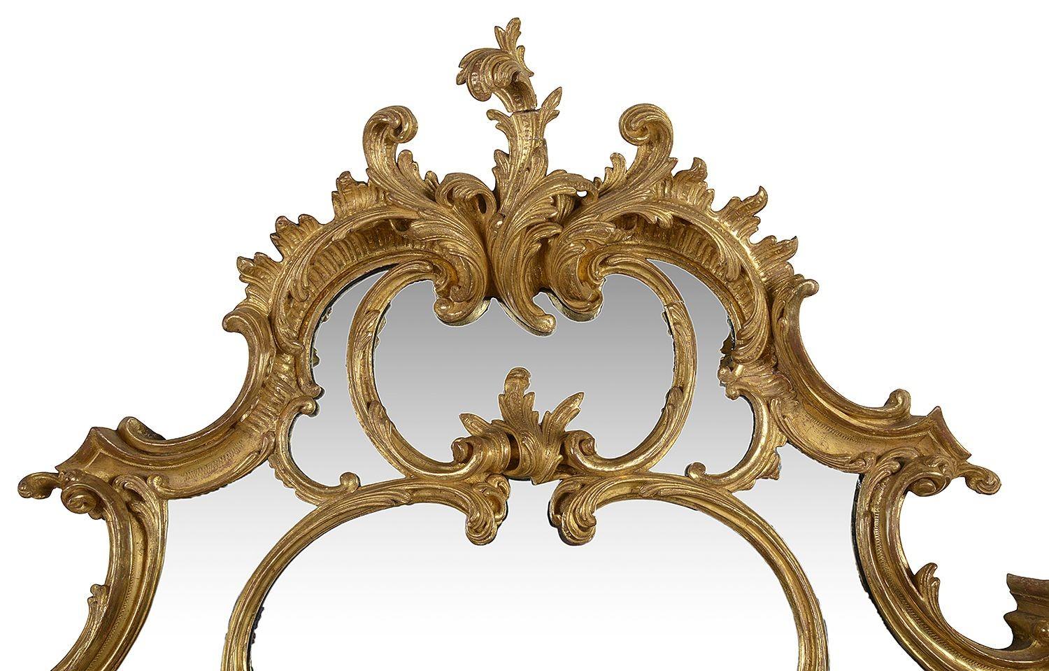 A very good quality 19th century hand carved gilt wood Chippendale style over mantel wall mirror. Having wonderful classical scrolling foliate decoration. Circa 1860-80

Batch 68 57248 YEUKK