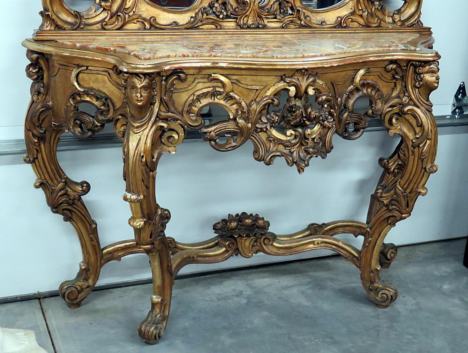 19th century carved giltwood marble top console with mirror. The console measures 36.5