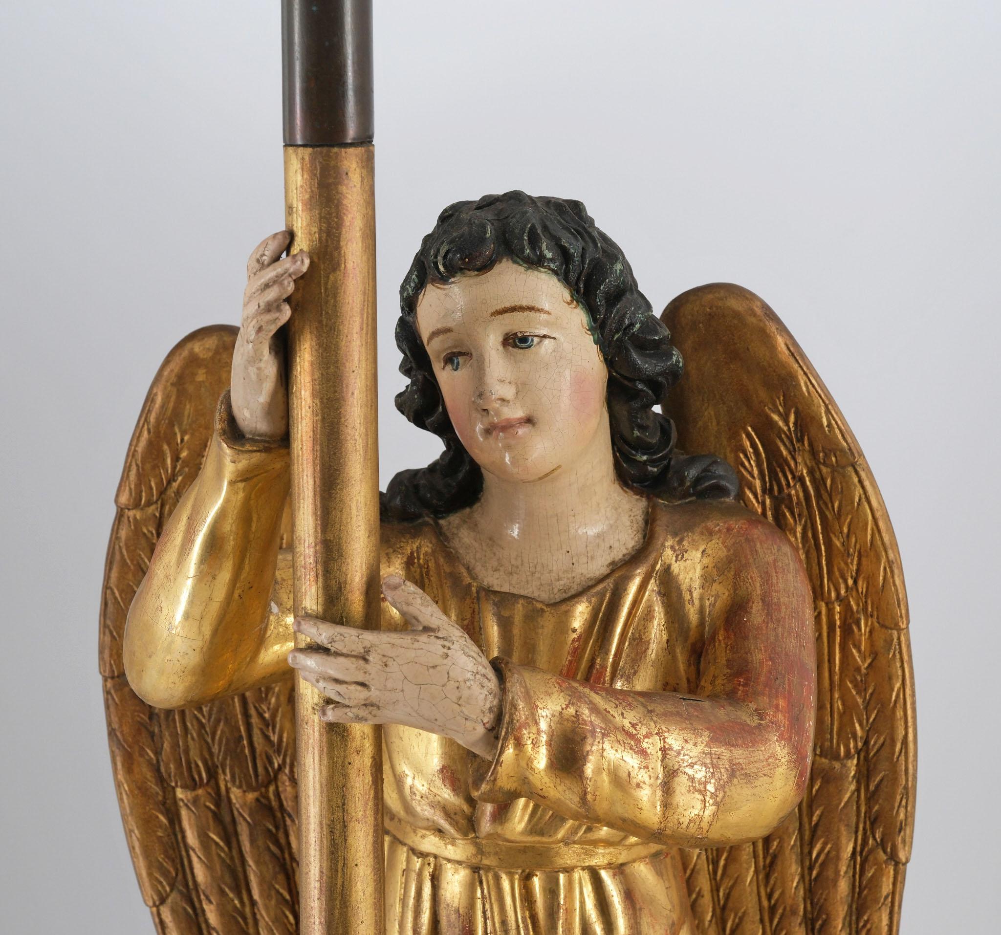 A beautiful 19th century giltwood and polychrome angel alter candle stick. Circa 1880.

Wonderfully crisp hand-carved lime. Note the spectacular water gilded folds of the gown, and serene polychrome painted features. The angel has gilt wings and