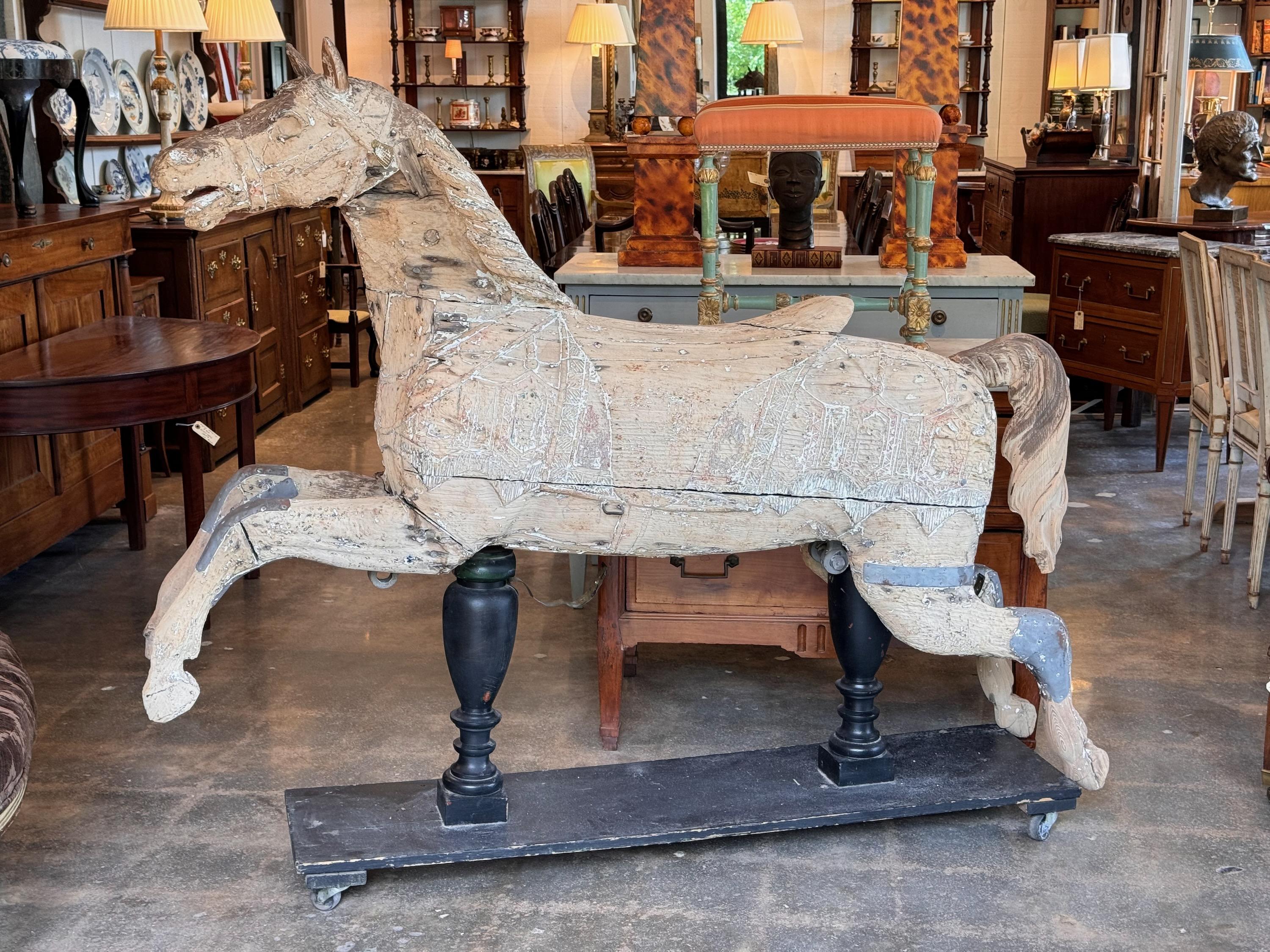 An impressive Merry Go Round Horse. Lots of character and old repairs.
