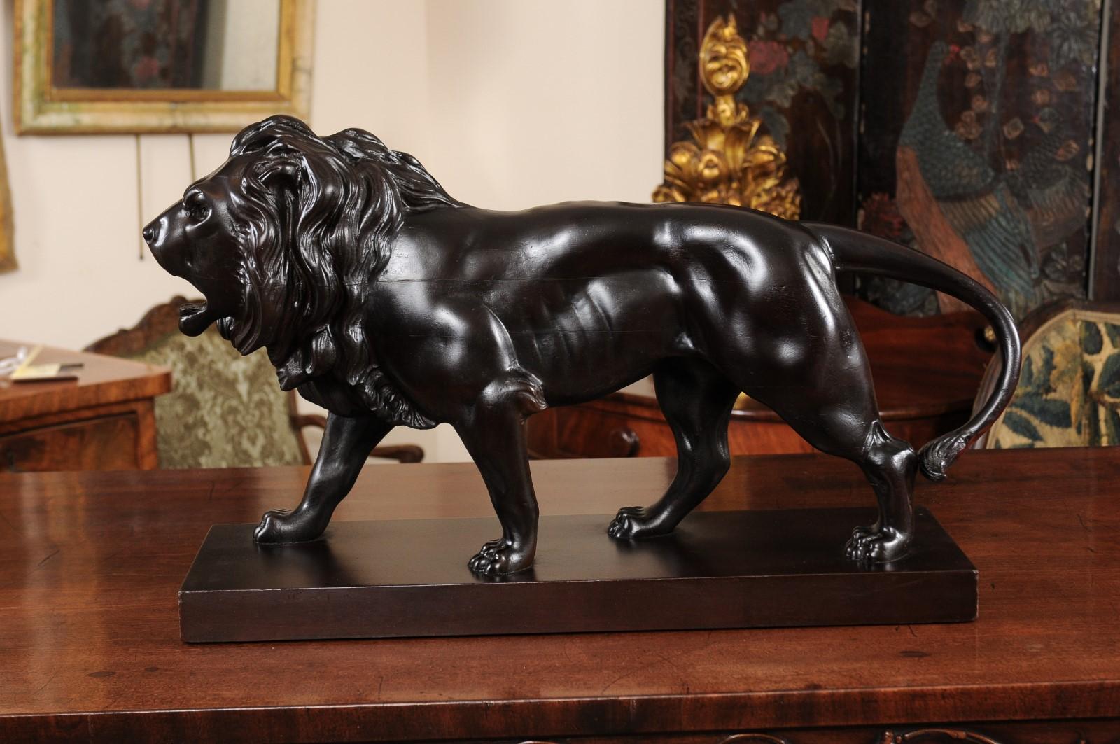 19th century Continental carved mahogany lion on plinth base.