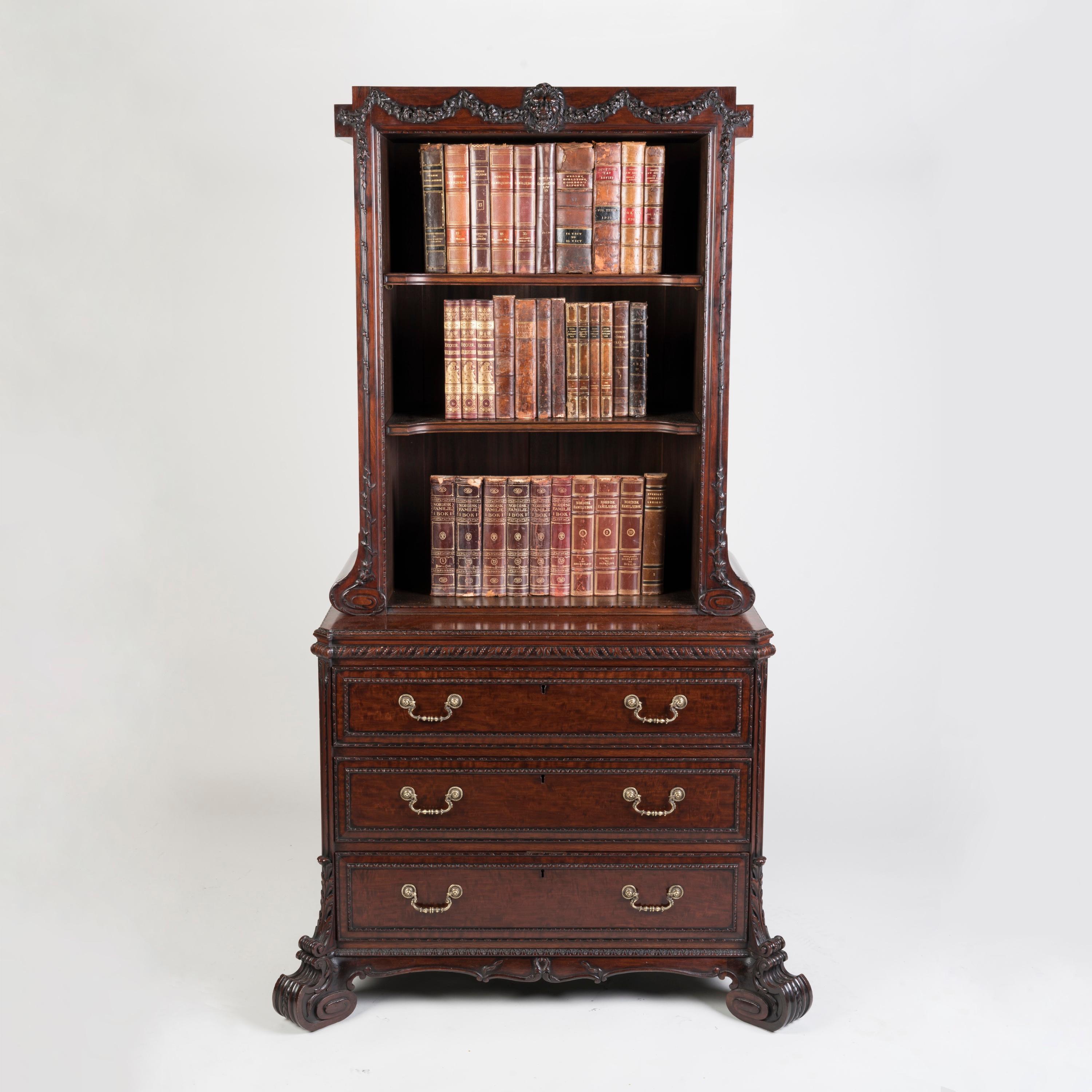 A Carved Mahogany Cabinet Bookcase in the George II Manner

by H. Samuel of London

Designed in the neo-classical fashion pioneered by Thomas Chippendale, the mahogany cabinet bookcase is crisply carved throughout, rising from voluminous scrolling