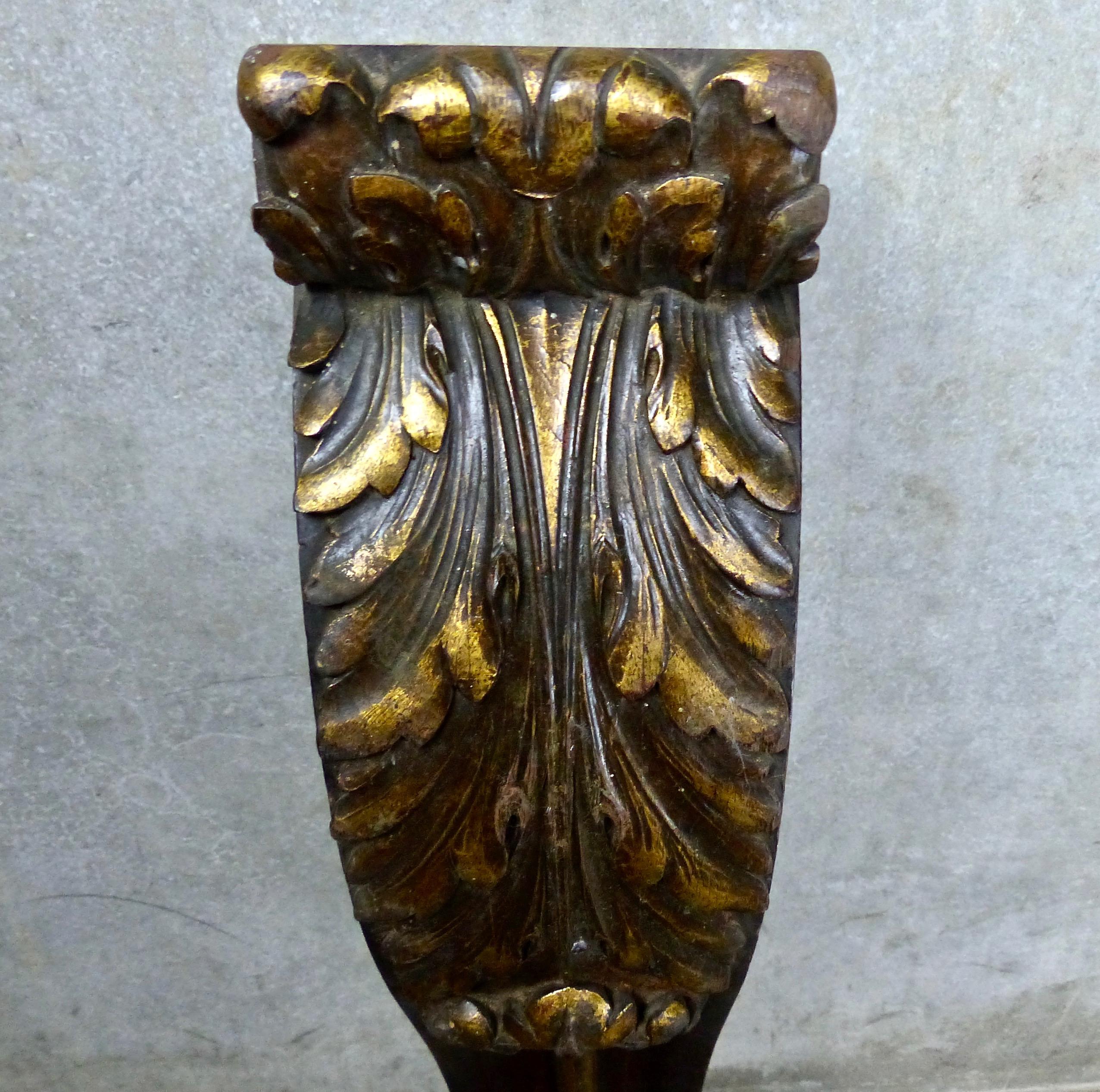 Set of four large matched corbels, hand-carved from mahogany. Expert scrollwork plus gilt finish on the leaf motifs. Salvaged from a bank building in Vancouver in the 1960s. Amazing surface detail. Use as architectural elements, re-purpose into