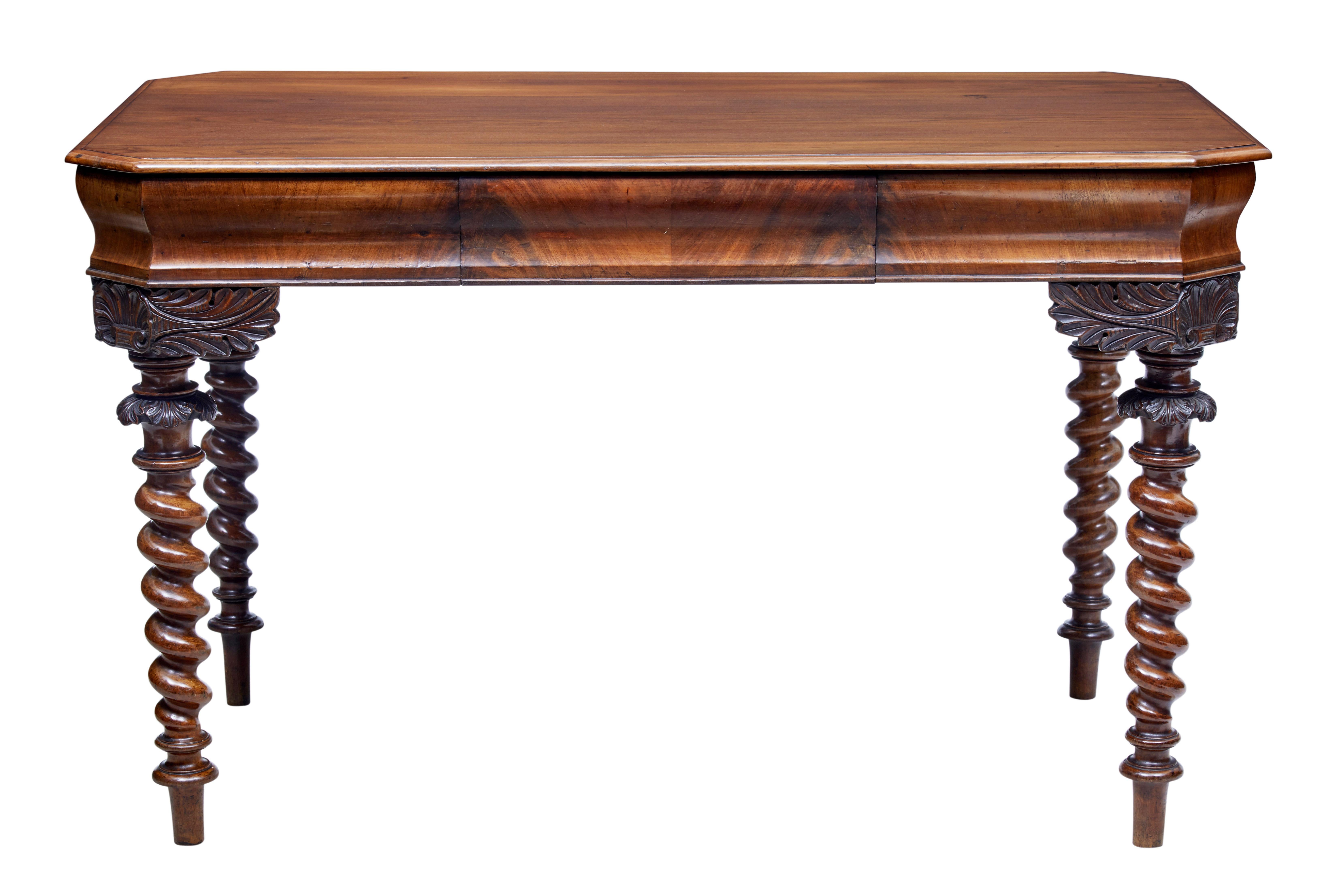 Mid-19th century Christian VIII Danish mahogany writing desk, circa 1840.

Mahogany top with flame mahogany sides. Single drawer to the front. Acanthus leaf leg mounts with barley twist legs. Due to the construction the legs on this table unscrew,