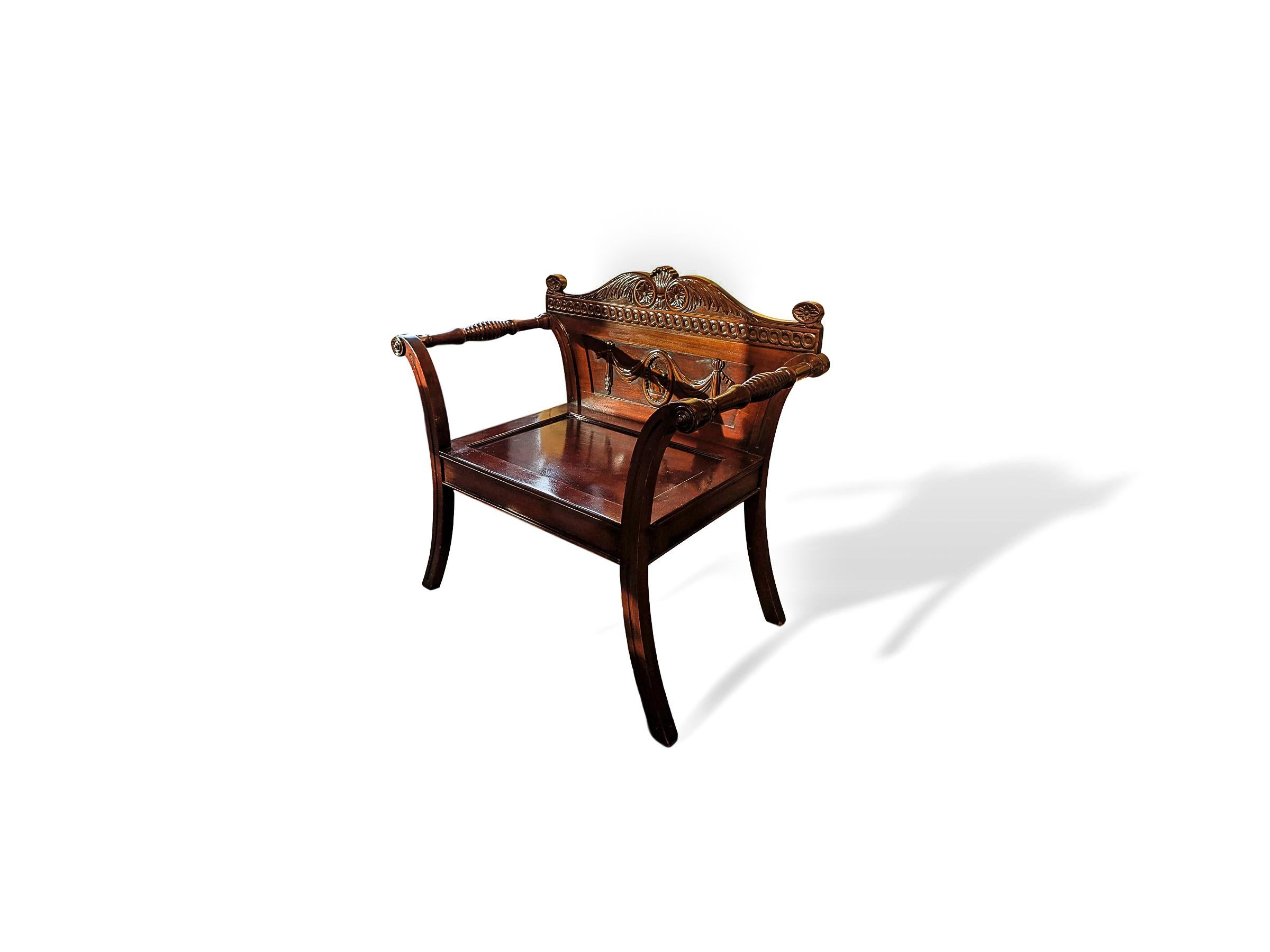 19th century carved mahogany Irish hall chair designed by celebrated 18th century architect and designer James Wyatt. Wyatt designed this chair for the hallway of Castle Coole, Co. Fermanagh, circa 1790. This is a later 19th century copy of the