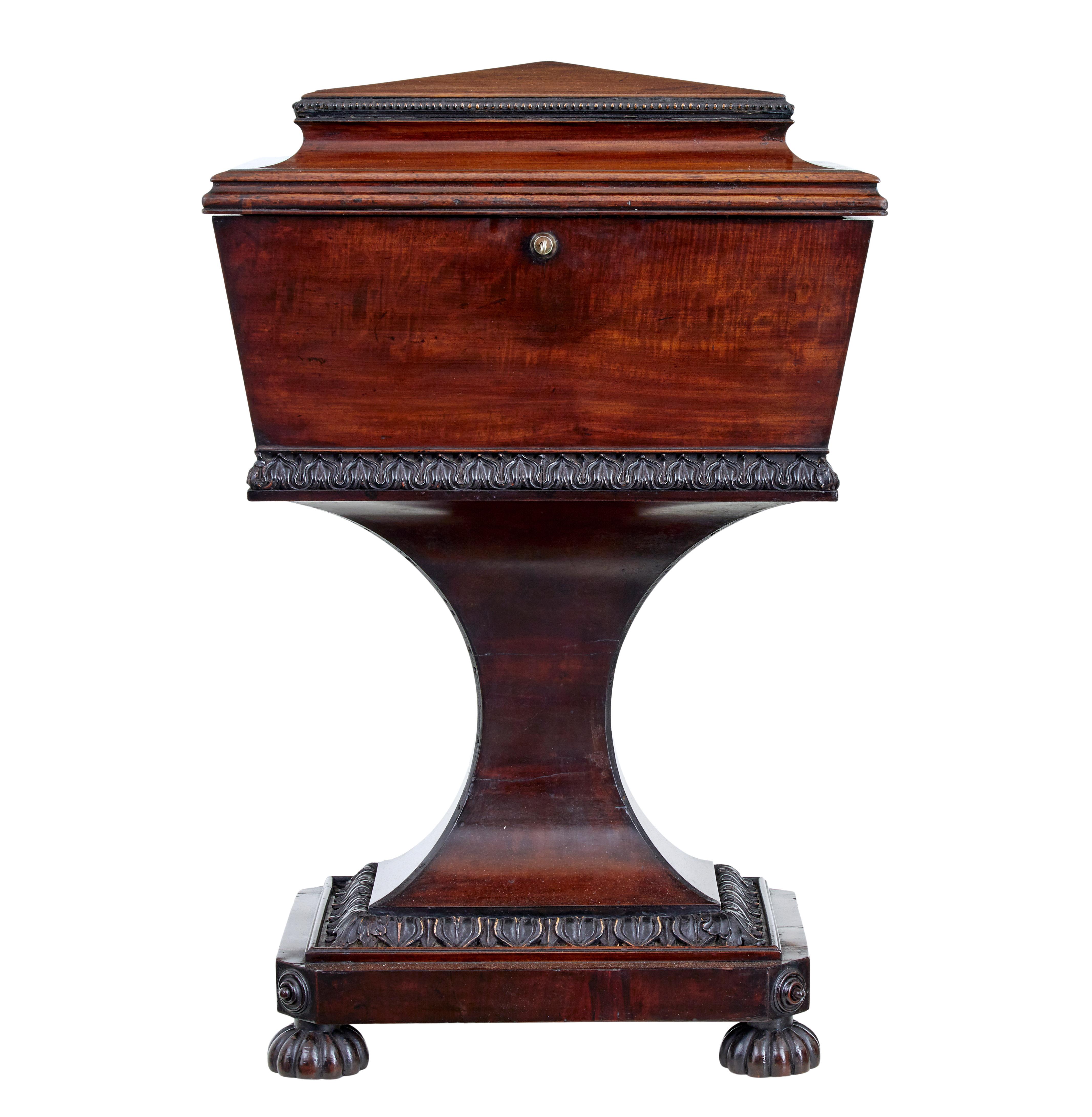 Superb quality Gillows regency mahogany teapoy circa 1820.

The main body being of sarcophagus form, which opens to 4 mahogany slides on each corner, 1 large tole compartment flanked either side by a smaller caddy. Original velvet lining to the lid
