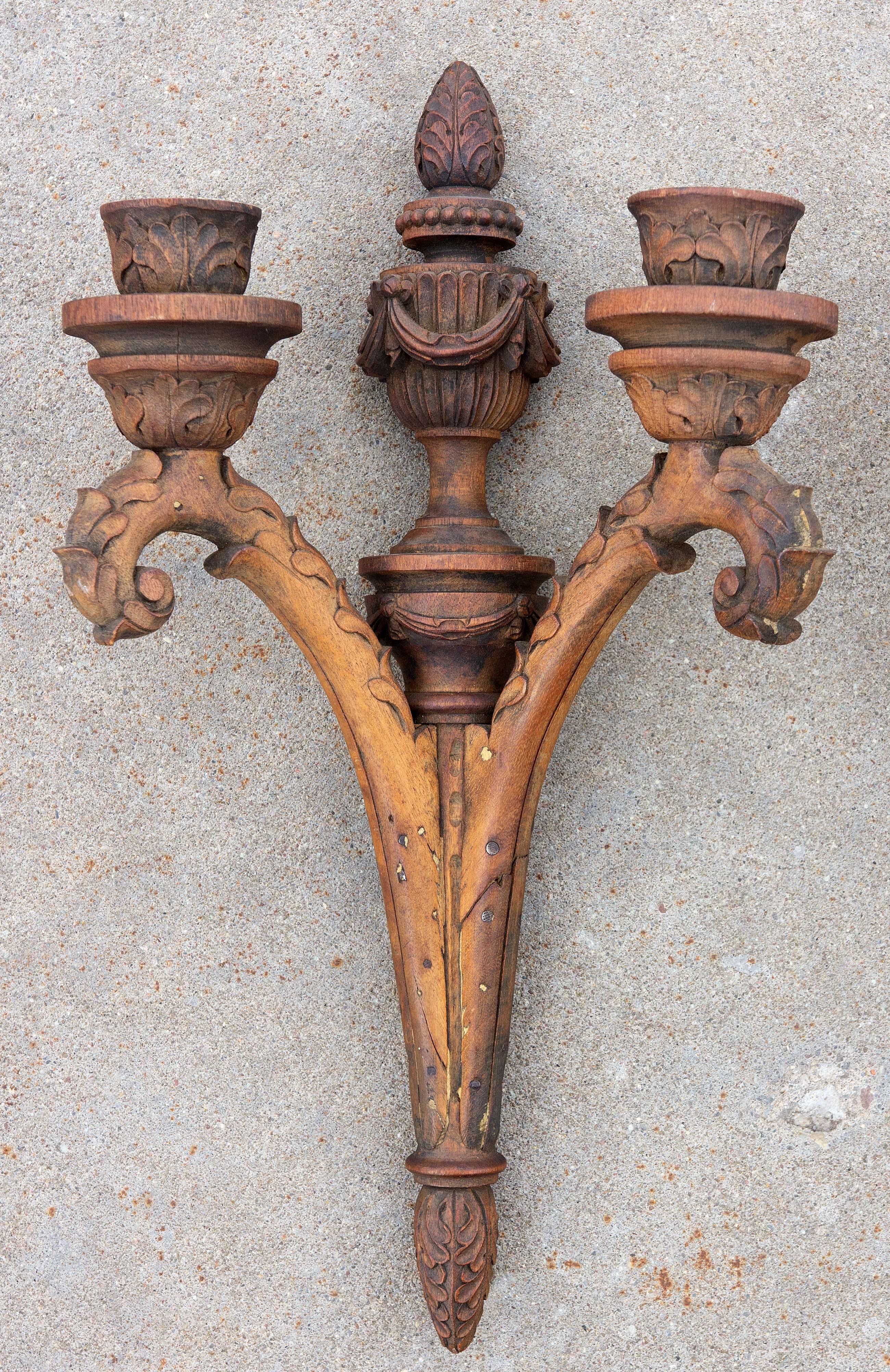 Pair of neoclassical style wood sconces. They are well carved. Mahogany. Late 19th century. They would look great painted.
