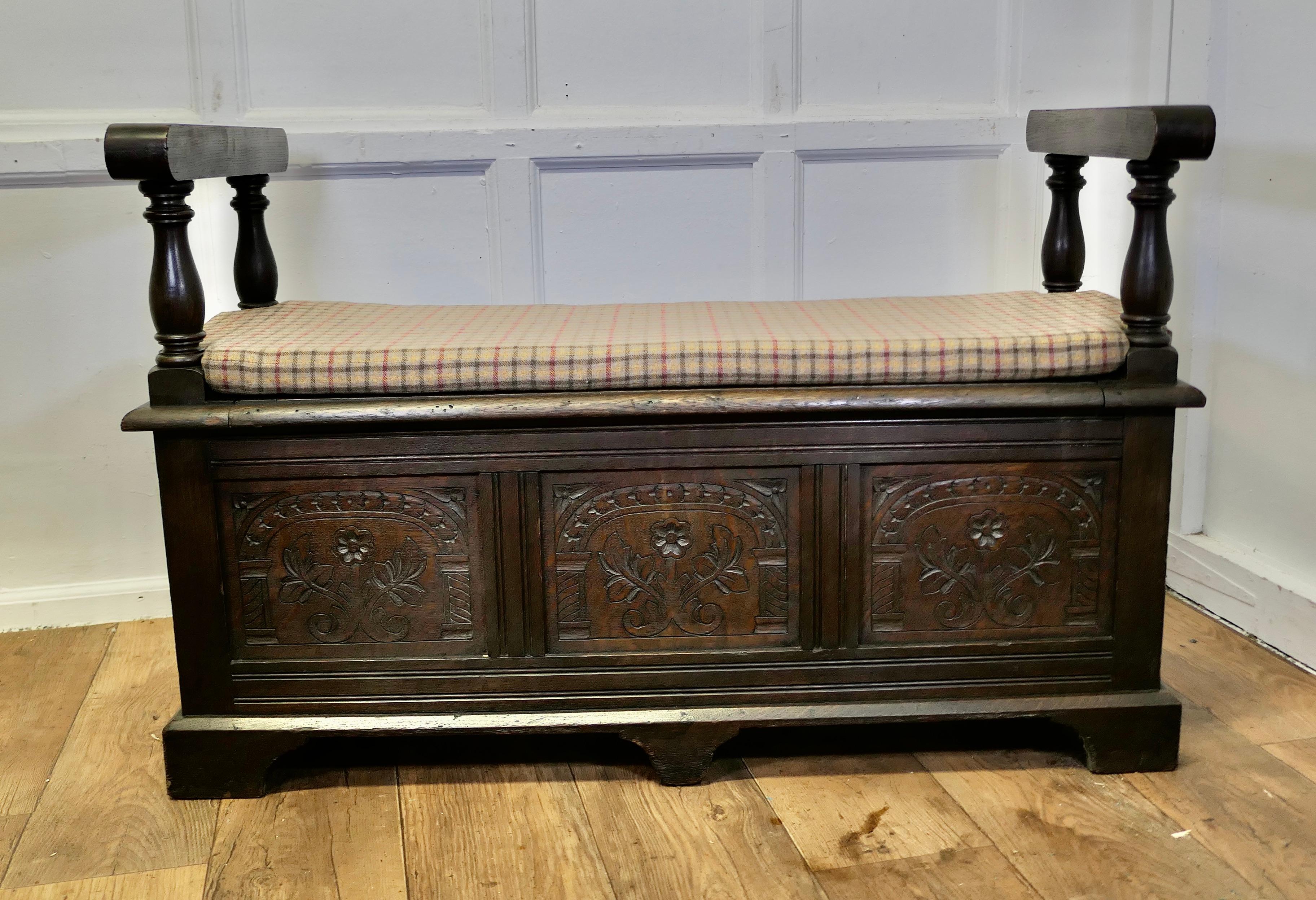 19th Century Carved Oak Coffer, Hall Seat

This is a lovely old piece and a very useful Hall Bench, it has storage under the seat and a new fitted cushion which has been upholstered with a wool tweed in earth colours
The coffer has a carved front