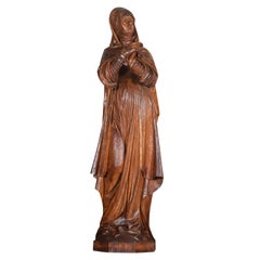 Figure de saint en chêne sculpté du XIXe siècle
