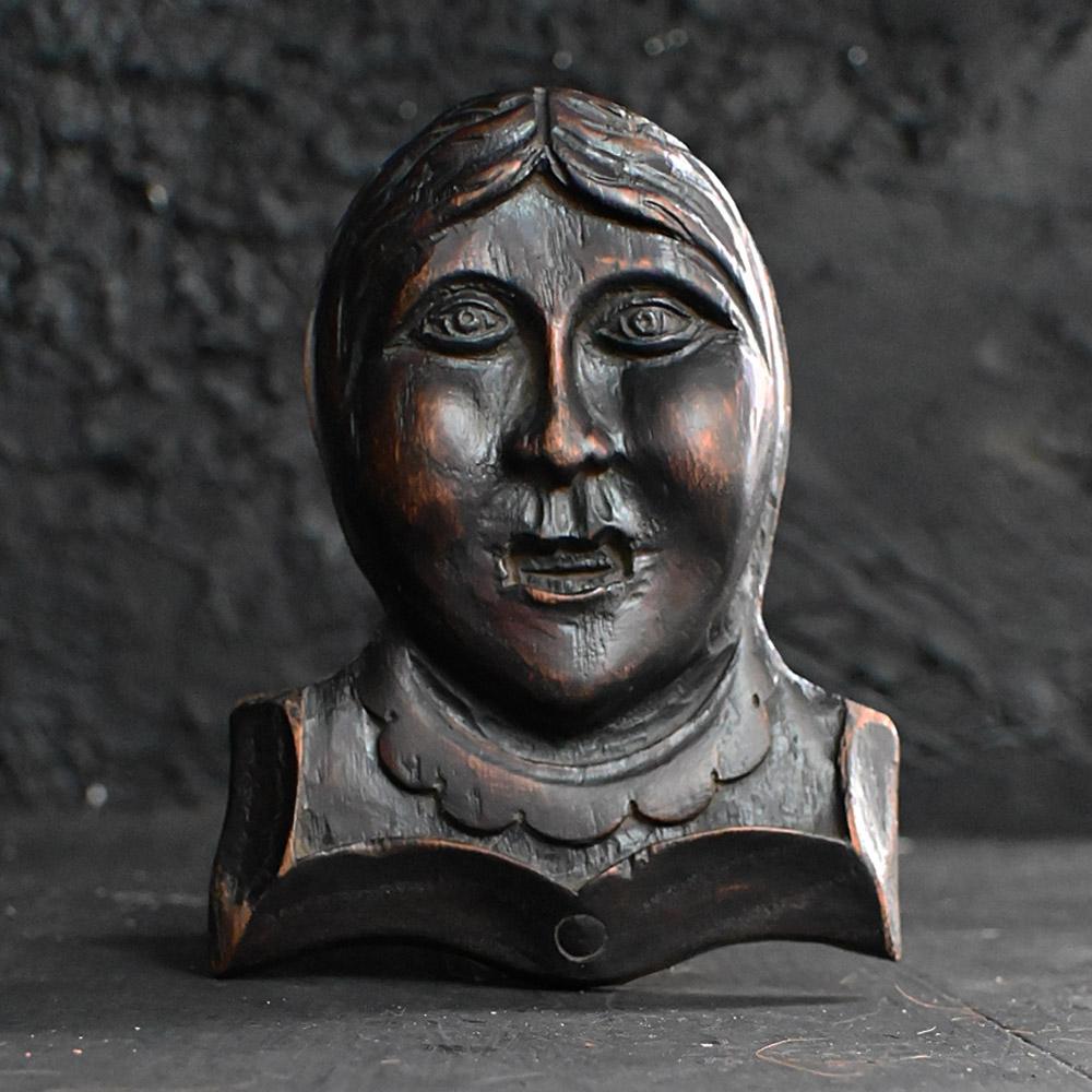 19th Century Carved Oak Folk Art Wall Figurative Plaque.

Just carved for the fun of it, this 19th century hand carved oak plaque illustrates an old female face with a freakishly awkward smile. Naïve in its detail, showing lots of natural age and a
