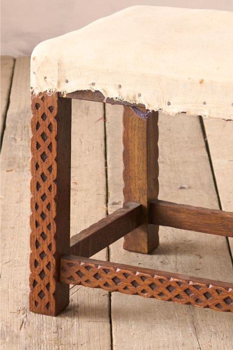 This is a very unusual 19th century footstool. Made from oak with wonderful carved designs to every surface. Good size and could even be used as a side table. The decoration really makes this a hugely decorative piece.

Height 44cm Width 56cm Depth