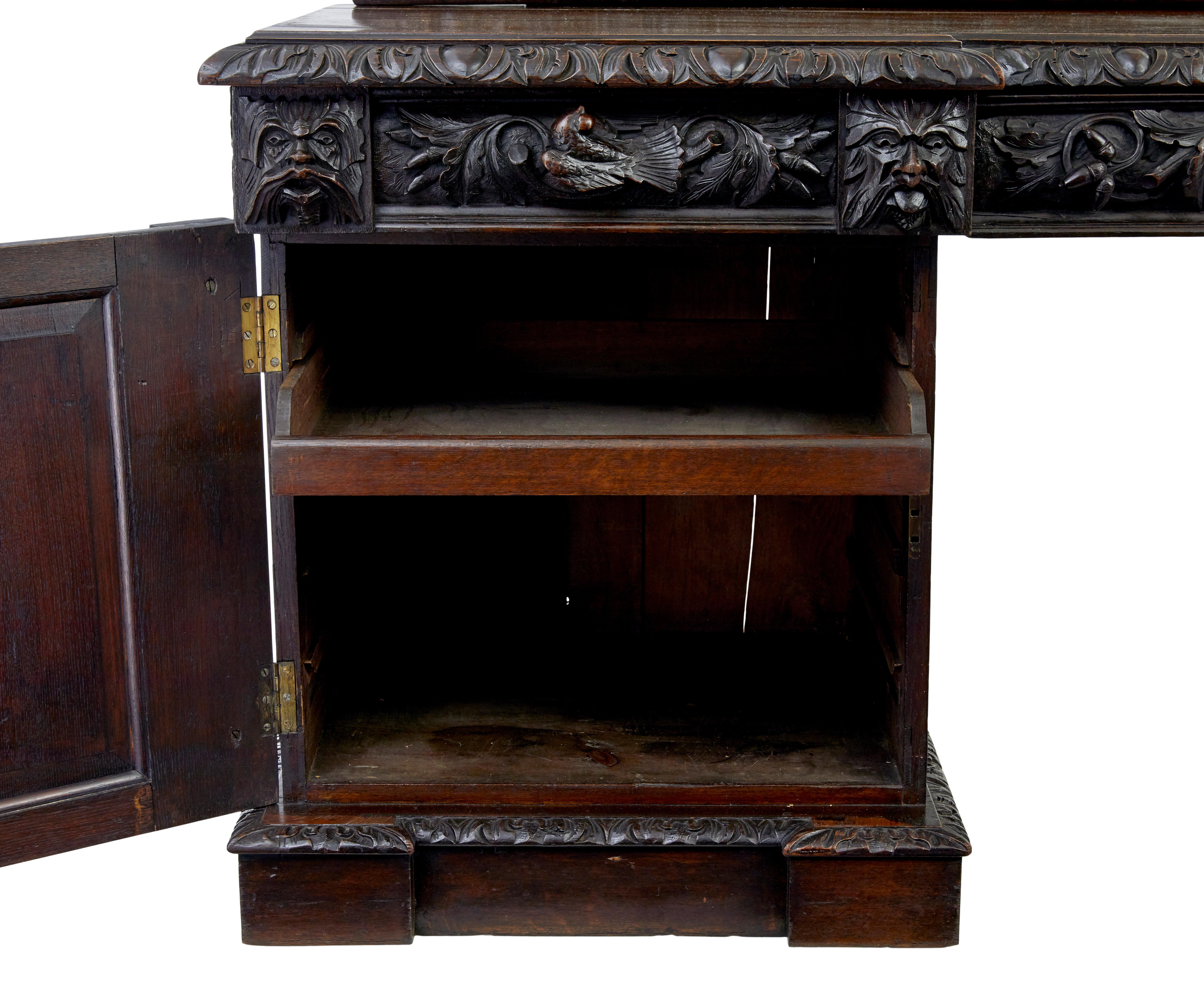 19th century carved oak mirrored sideboard of grand proportions, circa 1860.

Here we present a profusely carved buffet comprising of 4 sections. 2 pedestals, top surface and mirror.

Mirror with shaped cornice, carved figures and foliage. Top