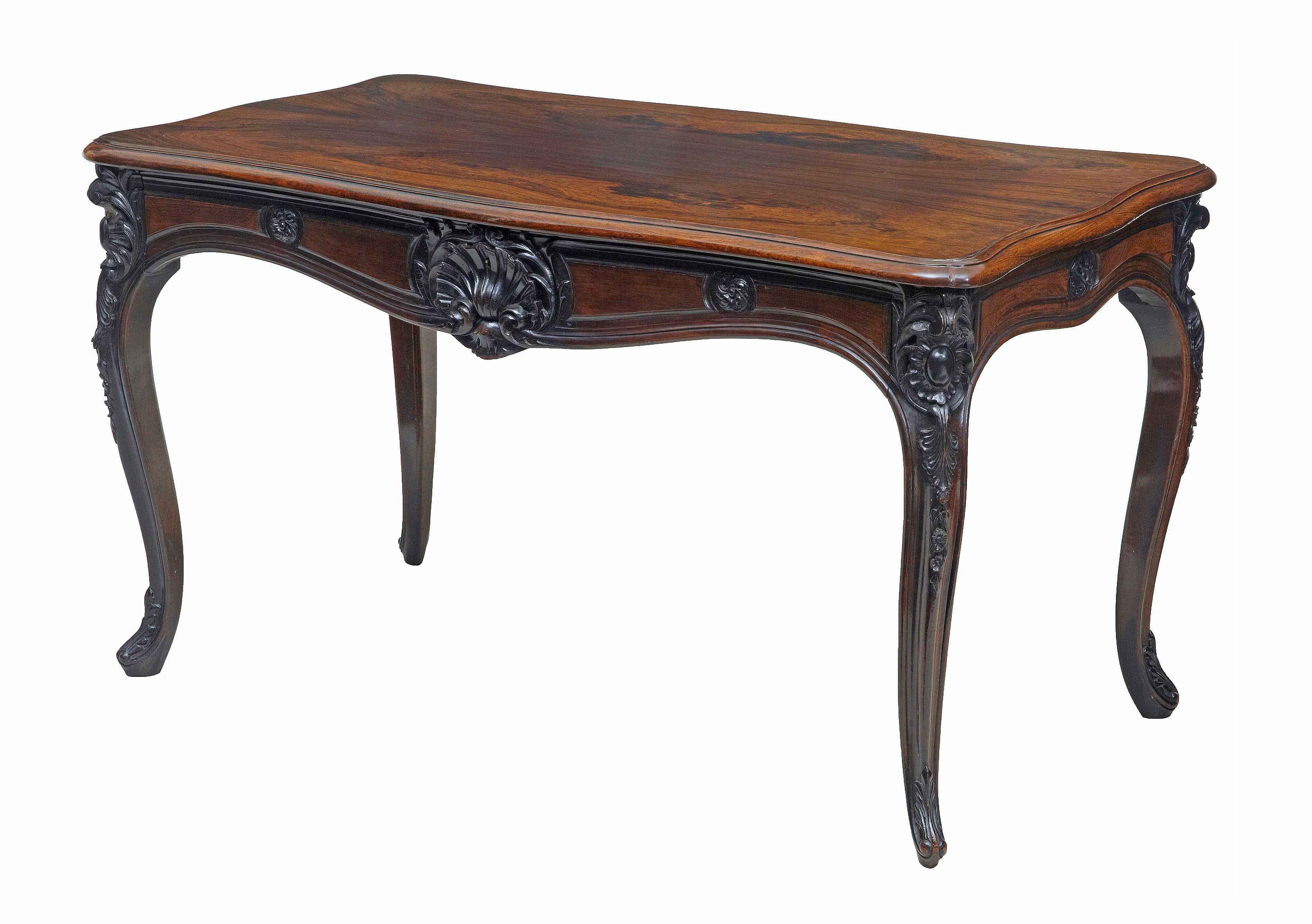 19th century carved palisander occasional table, circa 1870.

Good quality carved rosewood occasional table or desk, circa 1880.

Beautiful grain and color to this table that could be used as a sofa or hall table or a ladies desk.

Single