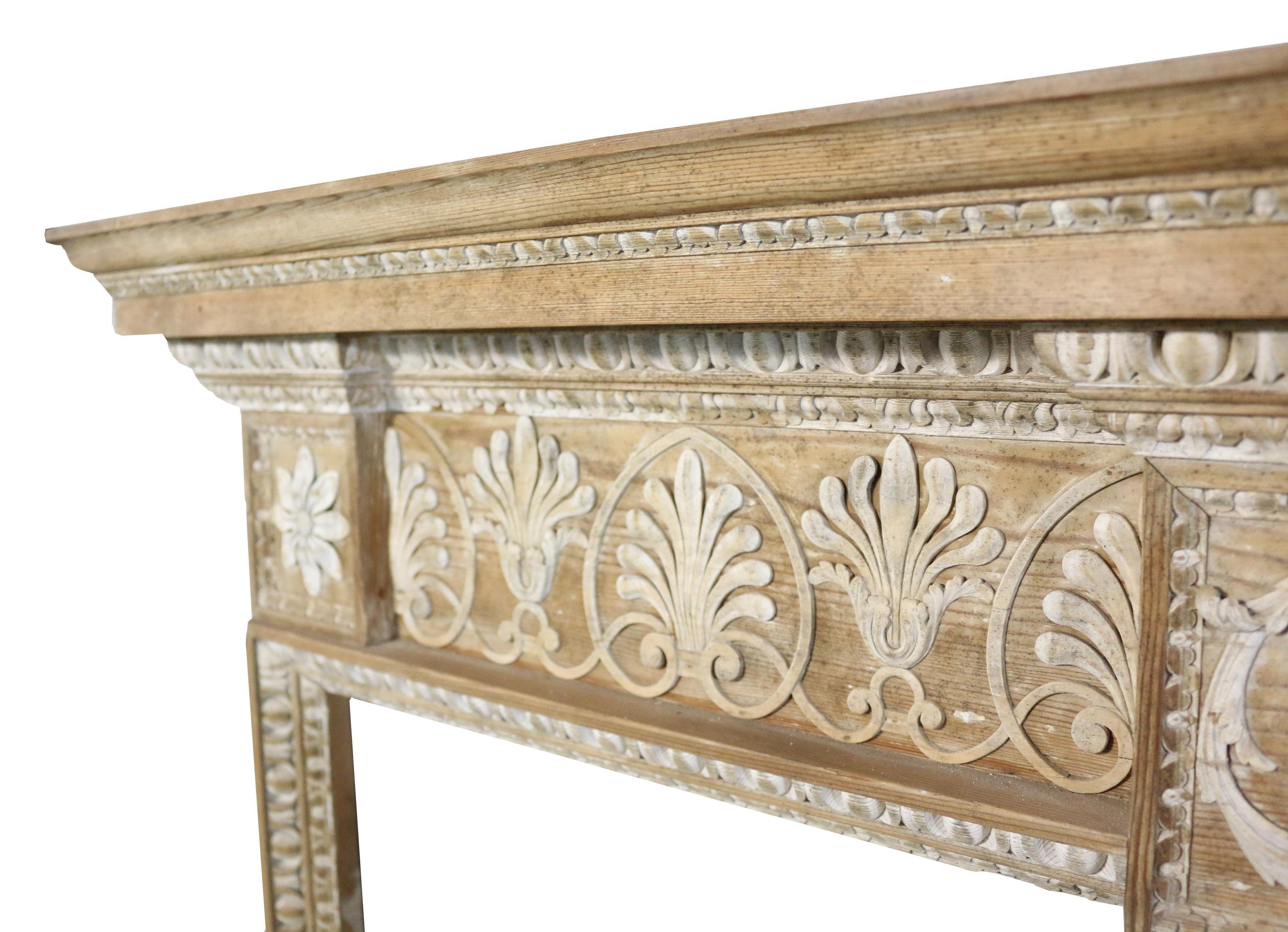 This fire surround is late 19th century and is in good condition for its age. Small losess to carvings and wear consistent with use. 

Measures: Height 124 cm

Width 158.5 cm

Depth 14.5 cm

Opening height 95.5 cm

Opening width 134