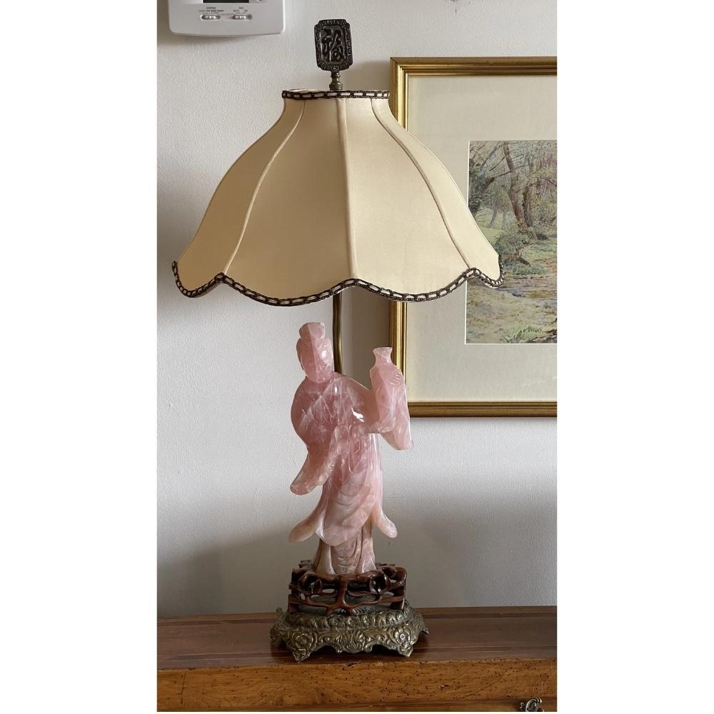 A 19th century Chinese carved rose quartz figure, now mounted as a table lamp. Height to top of finial 26.25”. 

