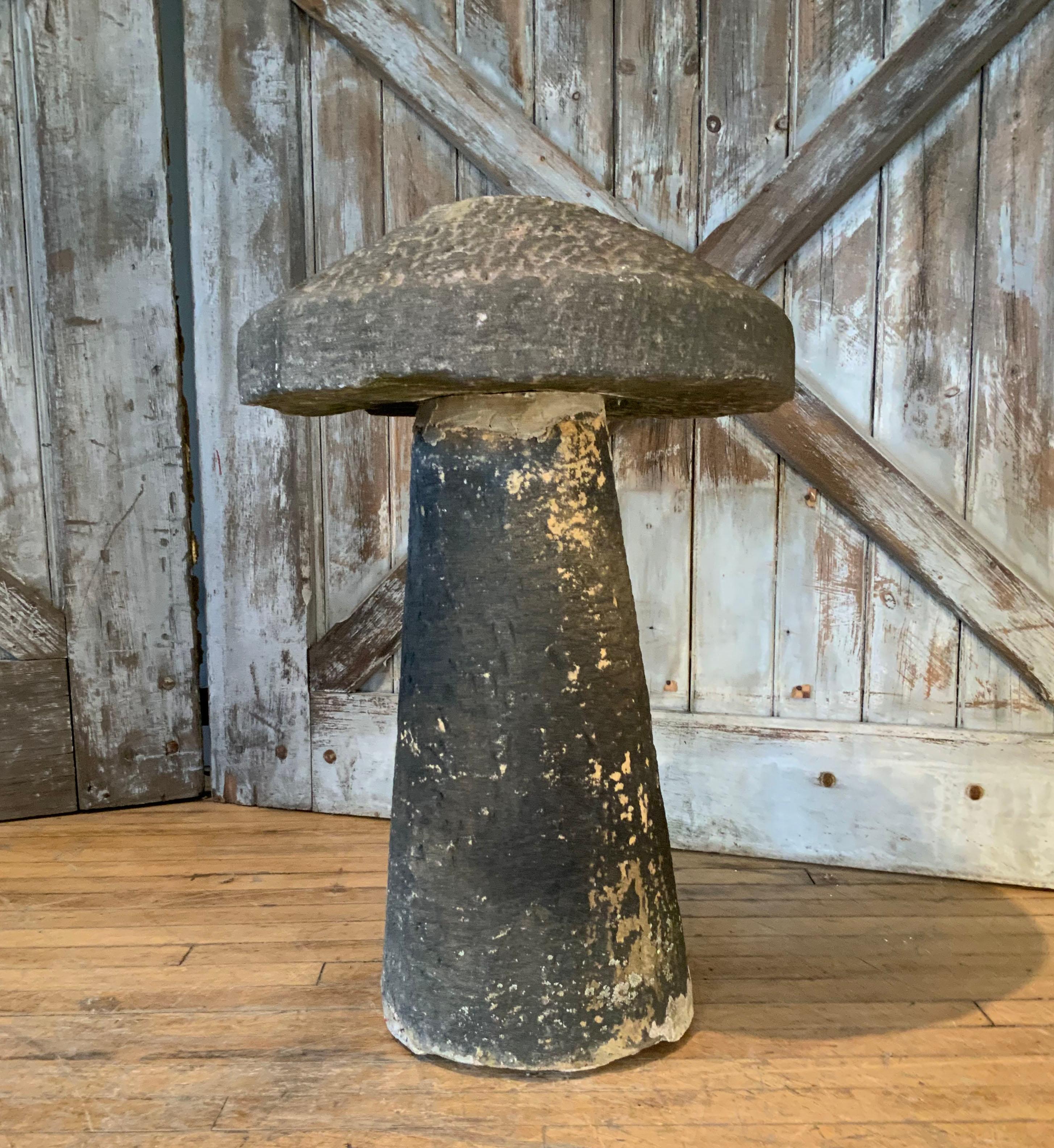 a mid 19th century carved Staddle Stone, english mushroom form. this stone had been painted black at some point in history, and has a few repairs.

Wonderful for garden art sculpture and planting areas. Charming and full of history. Staddle stones