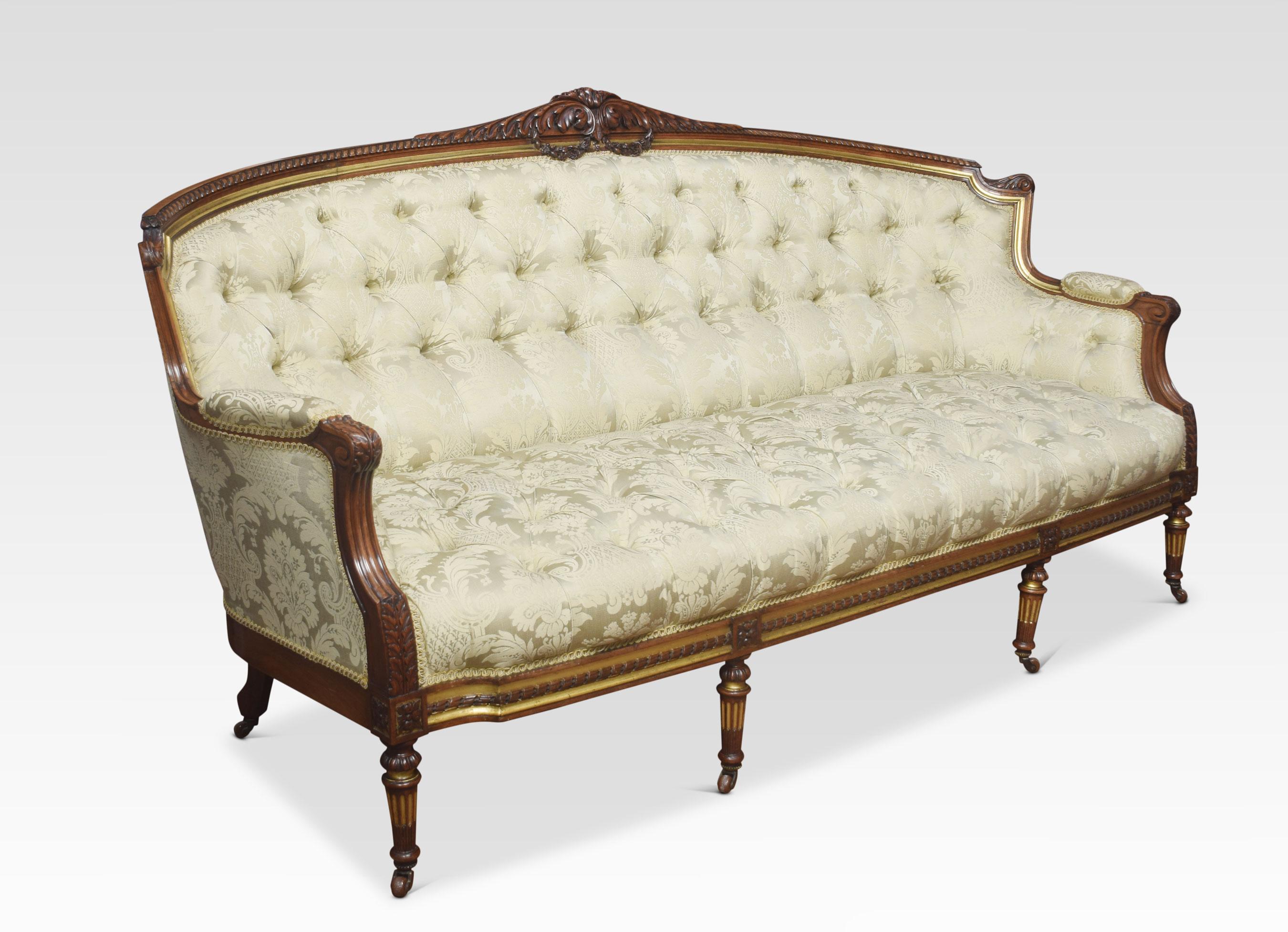 A large walnut framed settee, the finely carved parcel-gilt frame above upholstered back, seat and arms in deep buttoned damask fabric. All raised up on fluted reeded front legs terminating in ceramic castors.
Dimensions
Height 40 inches height to