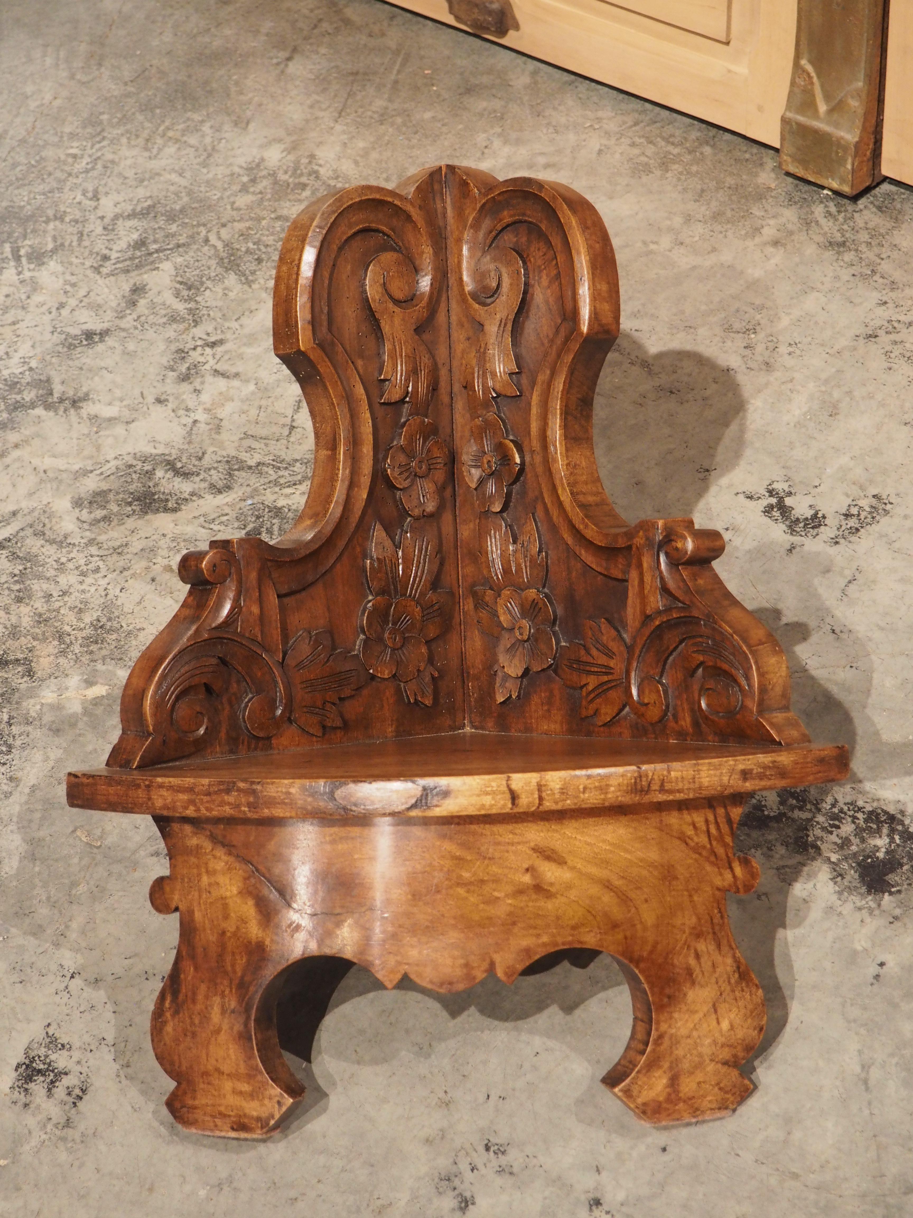 With a demi-lune shaped ledge and highly shaped walls, this French corner shelf is a beautiful decorative accessory/small wall architectural. Hand-carved in the 1800’s out of walnut, the highly worked walls contain floral margent motifs encompassed