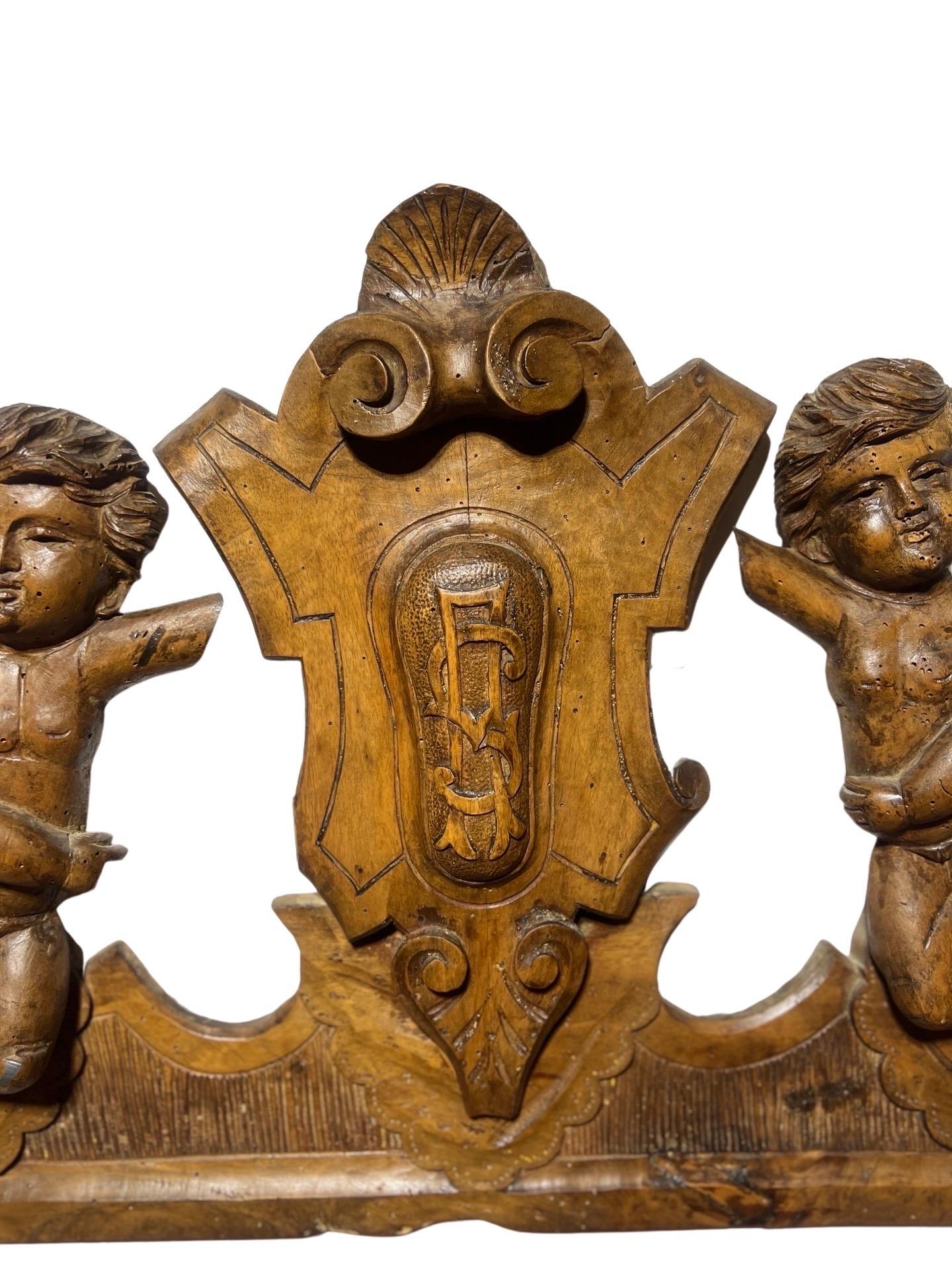 French 19th Century Carved Walnut Crown Piece or Crest With Monogram and Putti For Sale