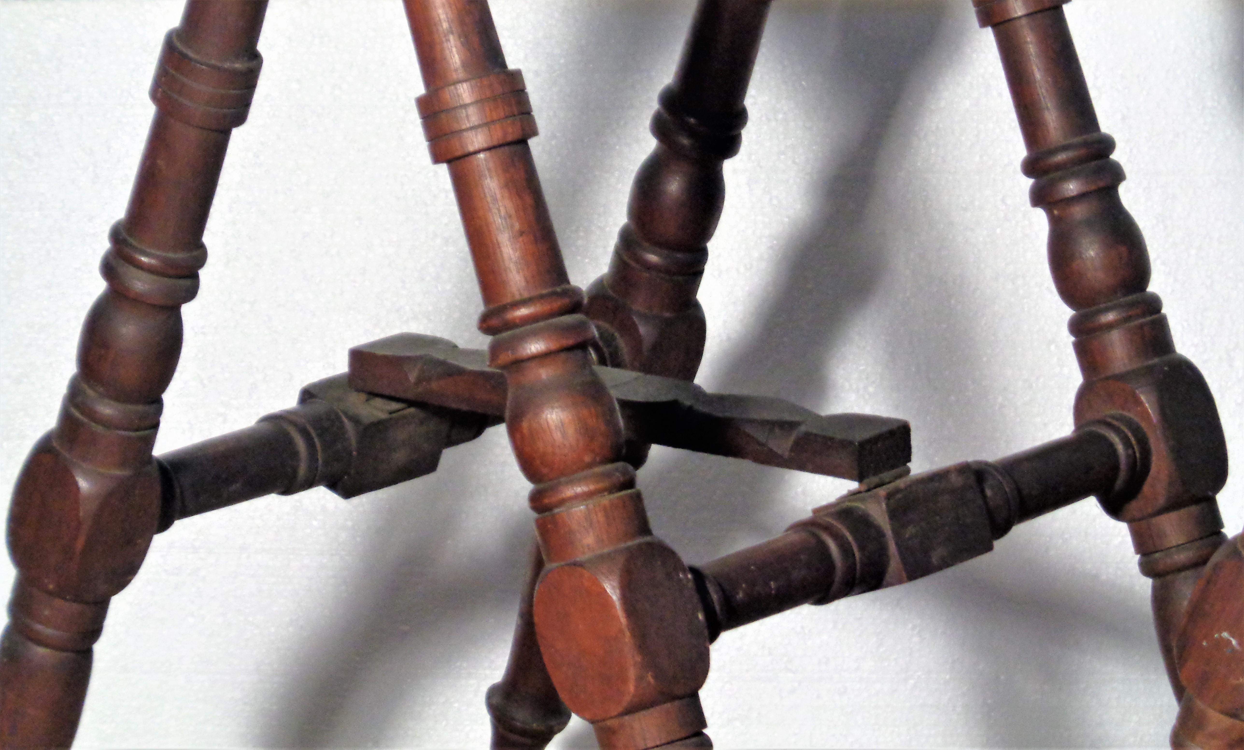 Pair of 19th century finely carved walnut folding sawhorse stands with brass hinges and brass feet in overall beautifully aged original old surface color. Measurements when open - 17
