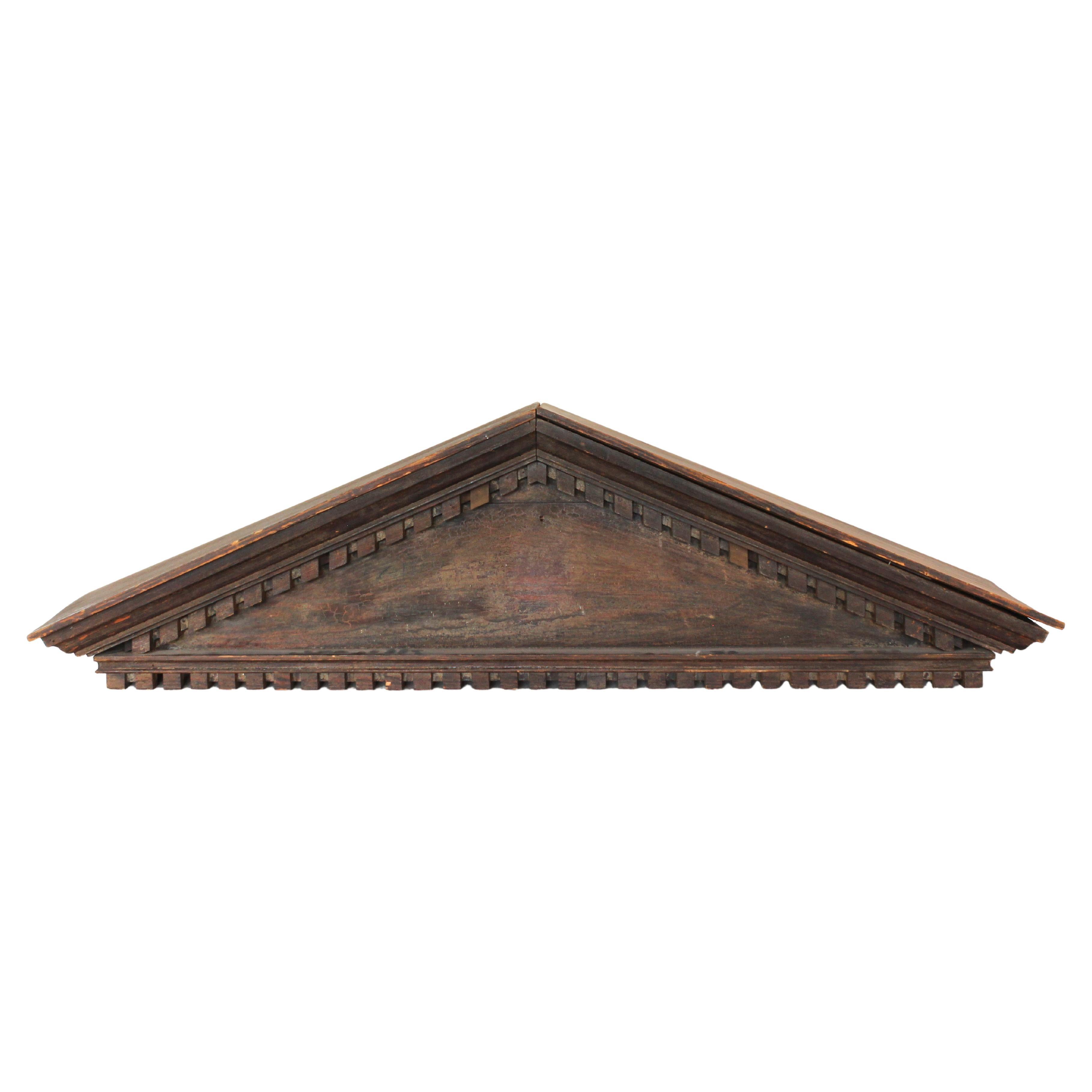 19th century carved wood architectural salvage/fragment pediment. Would work well as the crown of a case piece, has hooks for hanging on the wall.
