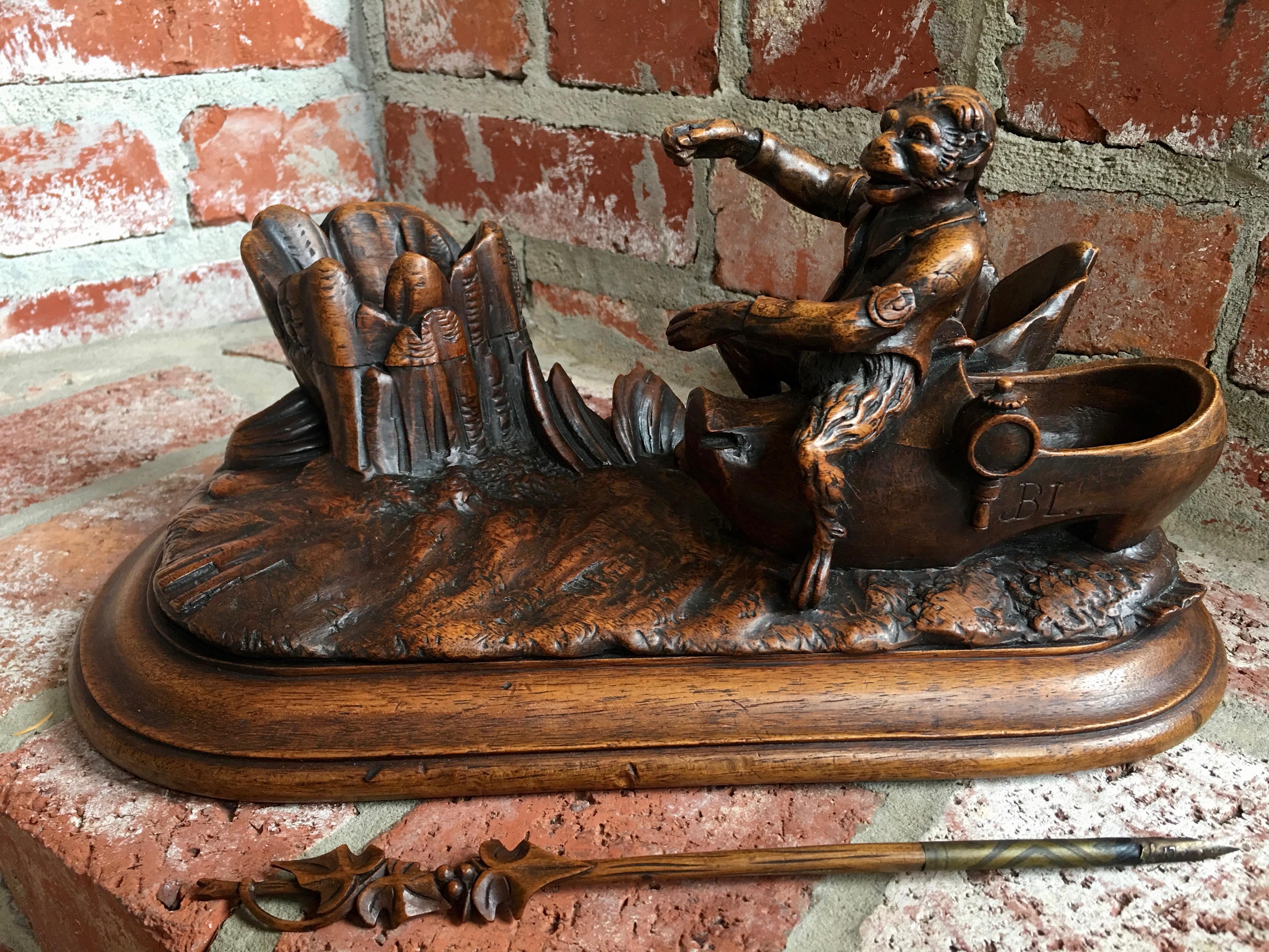 Direct from Europe, a rare antique carved wood Black Forest ink well, with a monkey on a Dutch shoe and military clothing!
~Exquisite attention to the details, the monkey’s hair, his face, his arms and even his Fingers!!~
We haven’t been able to