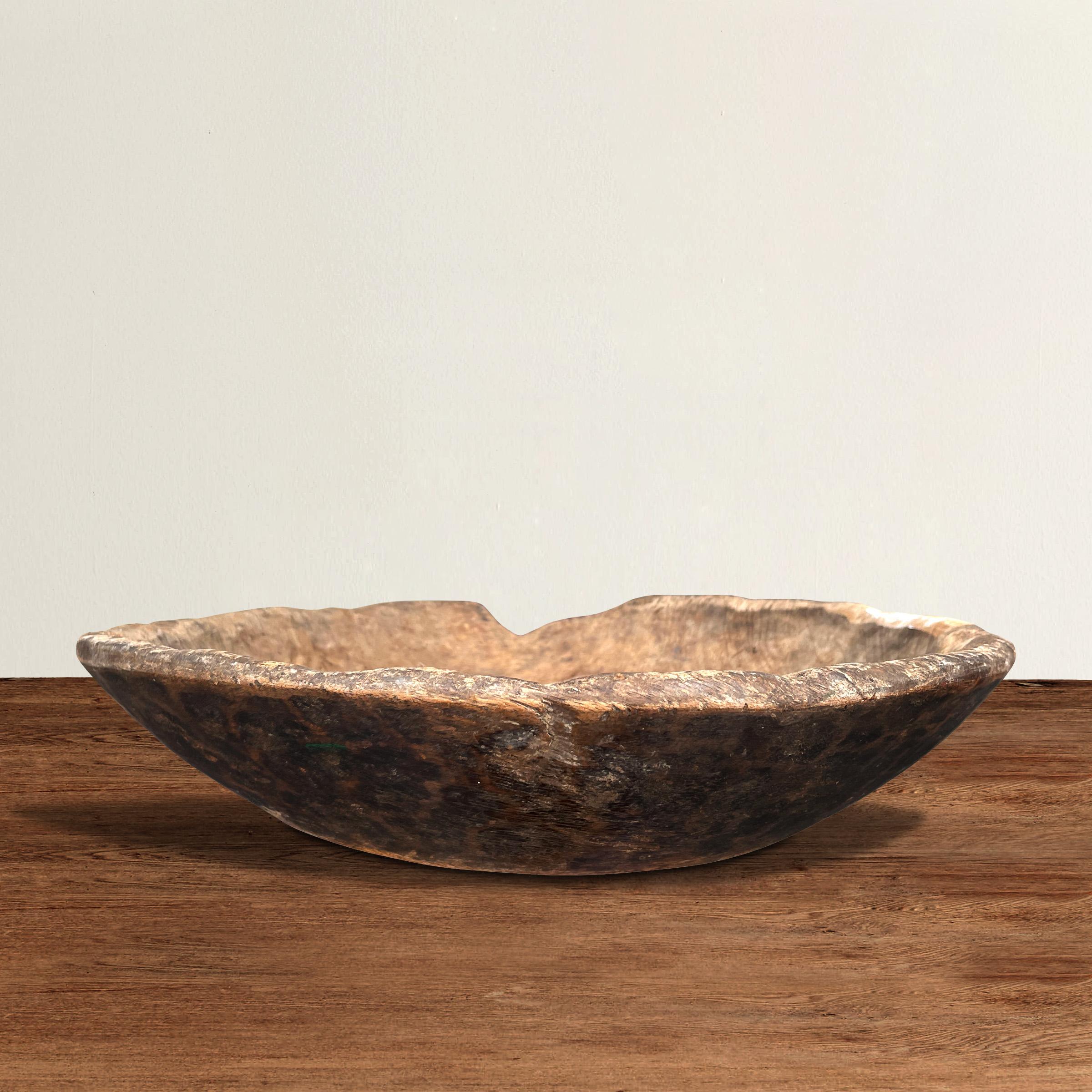 A wonderful 19th century American carved wood bowl or platter with a beautiful hand-hewn exterior, and with a beautiful patina only time can bestow.