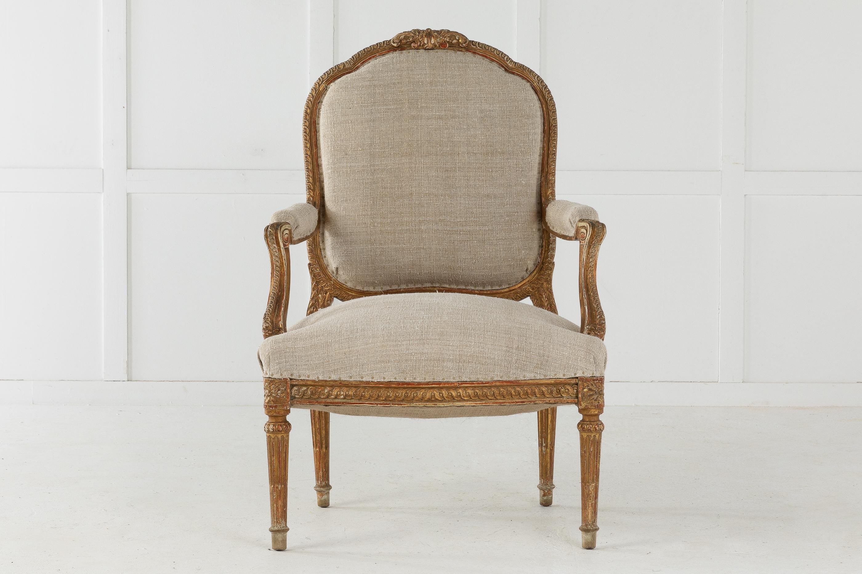19th century French carved wood chair retaining beautiful aged gilt. Fully upholstered by us with antique fabric.