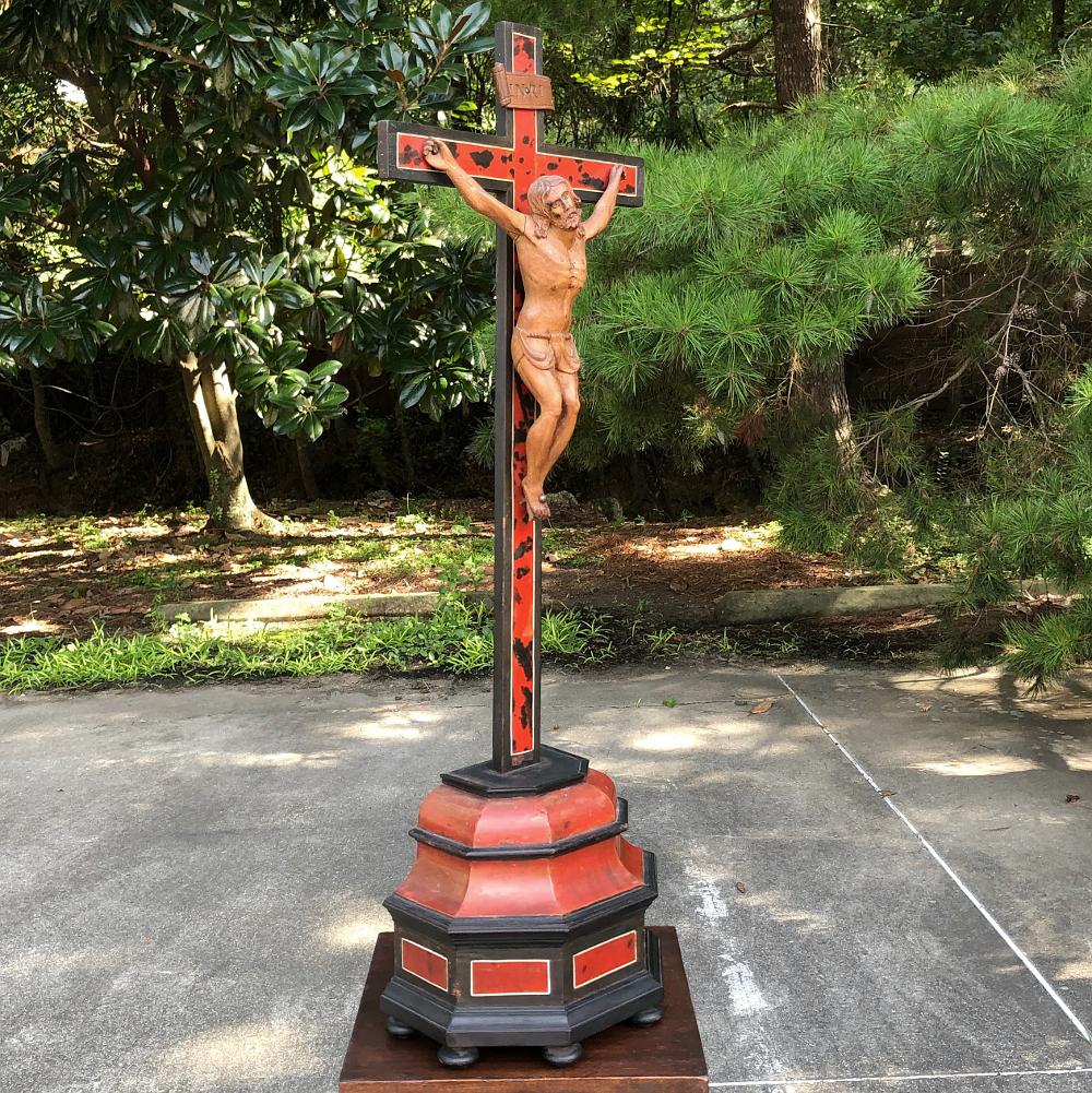 19th century carved wood crucifix was sculpted from olive wood then set upon an ebonized cross with base inset with faux tortoiseshell,
circa 1880s
Measures: 30 H x 8.5 W x 6 D.