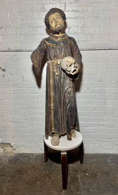 19th Century Carved Wood Religious Statue of a Saint holding skull