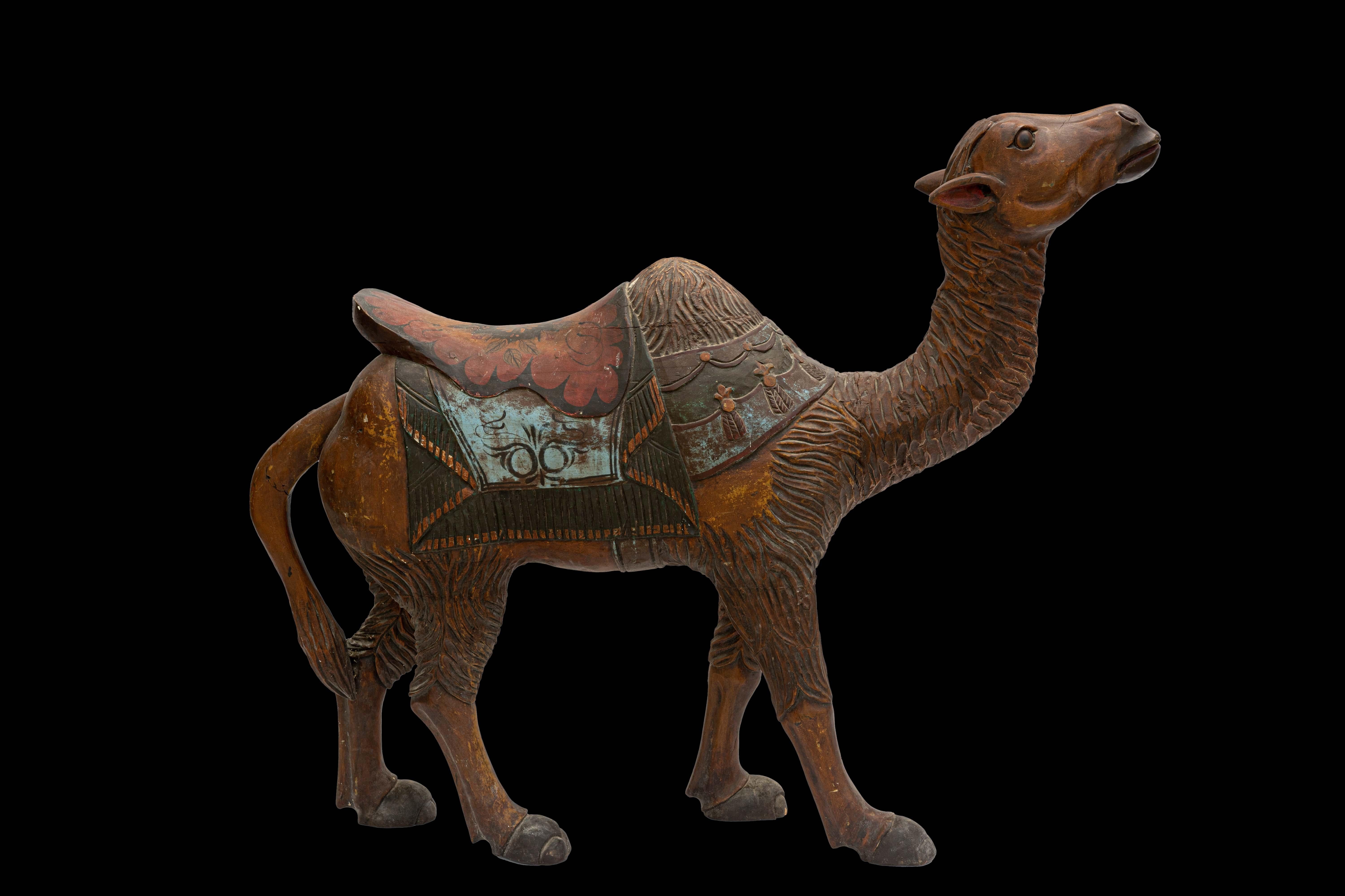 A beautiful carved and painted 19th Century wooden Carousal Camel.

Weighs Approximately: 55lb

Measures Approximately: 12