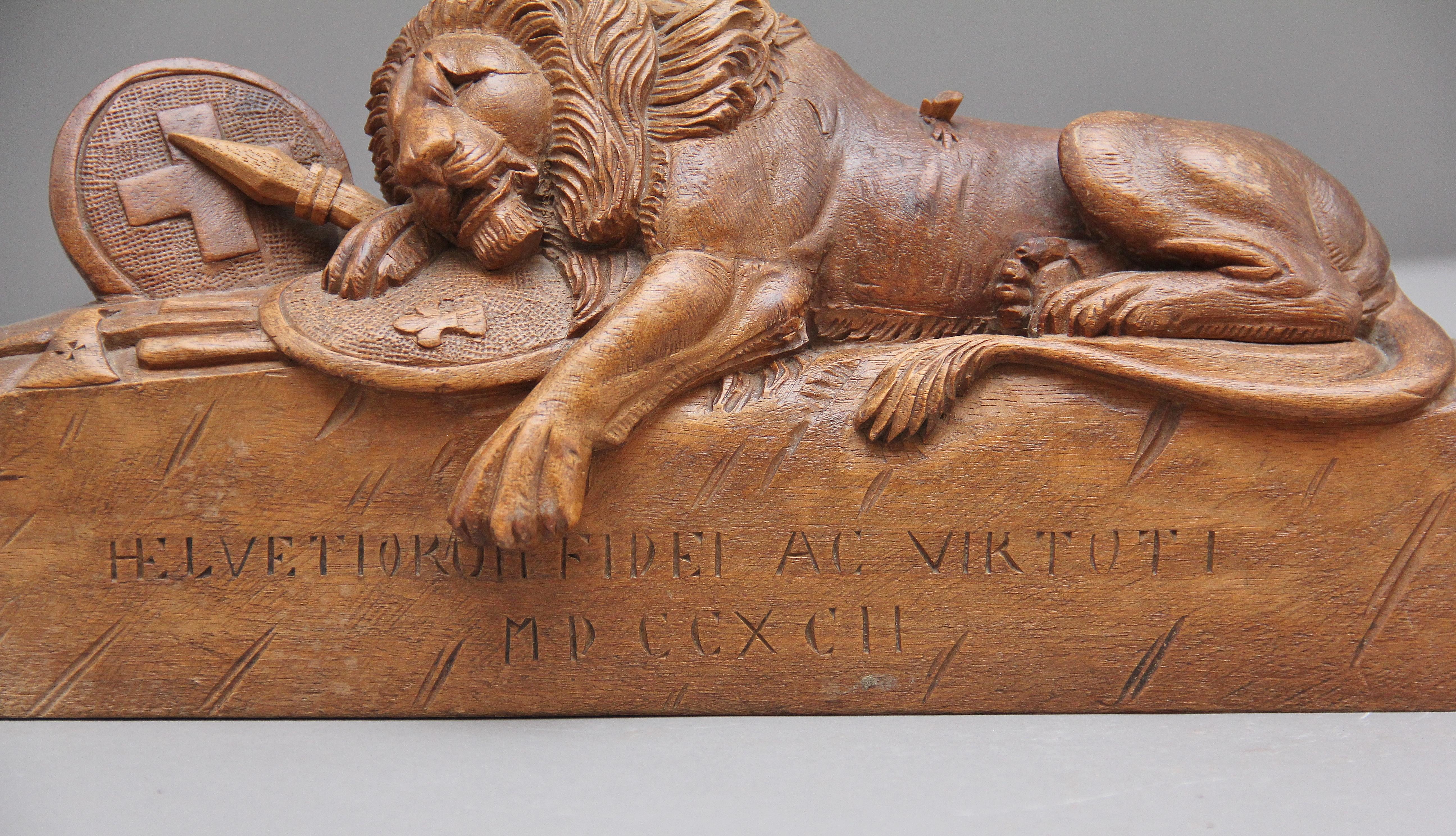 19th century Black Forest walnut carving of the lion of Lucerne resting upon armor and weapons. Lovely quality and crisp carving, circa 1880.

The Lion Monument, or the Lion of Lucerne, is a rock relief in Lucerne, Switzerland, designed by Bertel